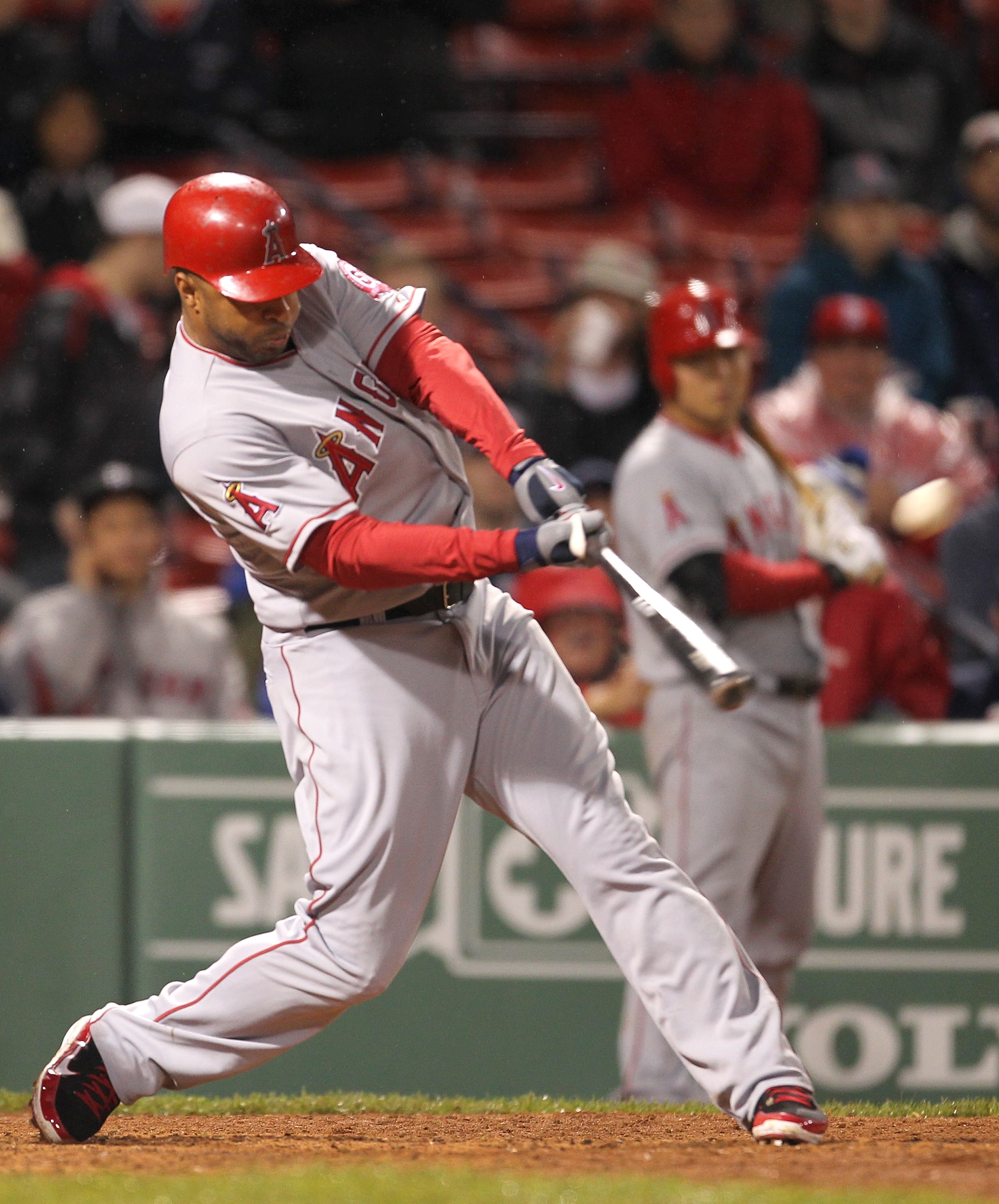 BOSTON, MA - MAY 4: Vernon Wells #10 of the Los Angeles Angels hits a two-run home run against the Boston Red Sox at Fenway Park on May 4, 2011 in Boston, Massachusetts. (Photo by Jim Rogash/Getty Images)