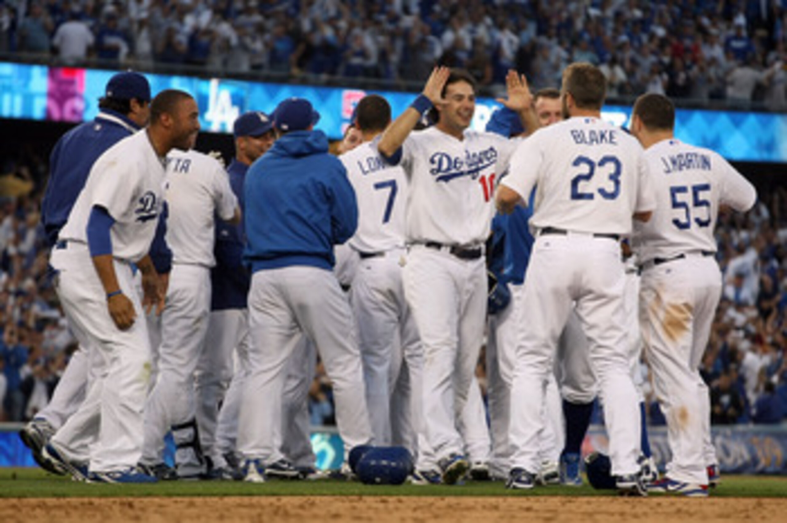 LOS ANGELES, CA - OCTOBER 08: The Los Angeles Dodgers celebrate after Mark Loretta #5 hit a walk-off RBI to defeat the St. Louis Cardinals in Game Two of the NLDS during the 2009 MLB Playoffs at Dodger Stadium on October 8, 2009 in Los Angeles, Californi LOS ANGELES, CA - OCTOBER 08: The Los Angeles Dodgers celebrate after Mark Loretta #5 hit a walk-off RBI to defeat the St. Louis Cardinals in Game Two of the NLDS during the 2009 MLB Playoffs at Dodger Stadium on October 8, 2009 in Los Angeles, Californi
