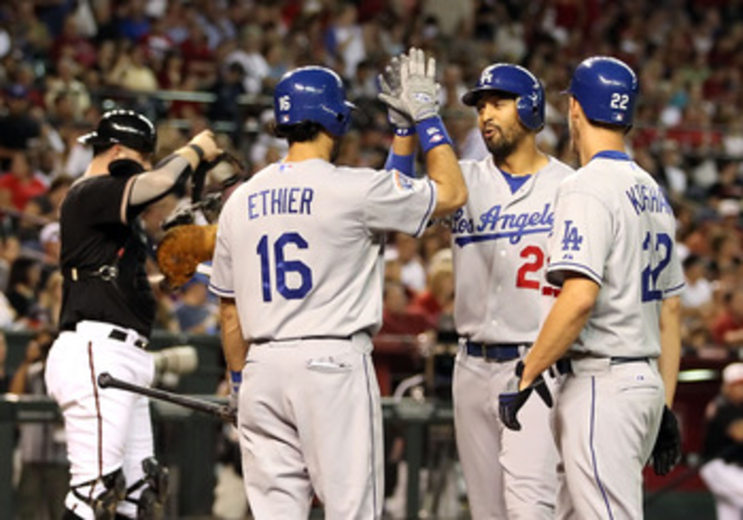 PHOENIX - JULY 03: Matt Kemp #27 of the Los Angeles Dodgers is congratulated by teammates Andre Ethier #16 and Clayton Kershaw #22 after hitting a 2 run home run against the Arizona Diamondbacks during the second inning of the Major League Baseball game PHOENIX - JULY 03: Matt Kemp #27 of the Los Angeles Dodgers is congratulated by teammates Andre Ethier #16 and Clayton Kershaw #22 after hitting a 2 run home run against the Arizona Diamondbacks during the second inning of the Major League Baseball game