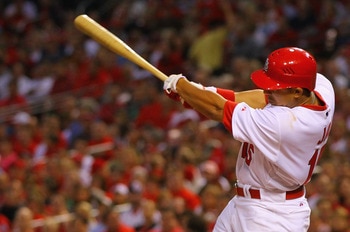 ST. LOUIS, MO - MAY 18: Jon Jay #15 of the St.Louis Cardinals hits a two-run single against the Houston Astros at Busch Stadium on May 18, 2011 in St. Louis, Missouri.  (Photo by Dilip Vishwanat/Getty Images)