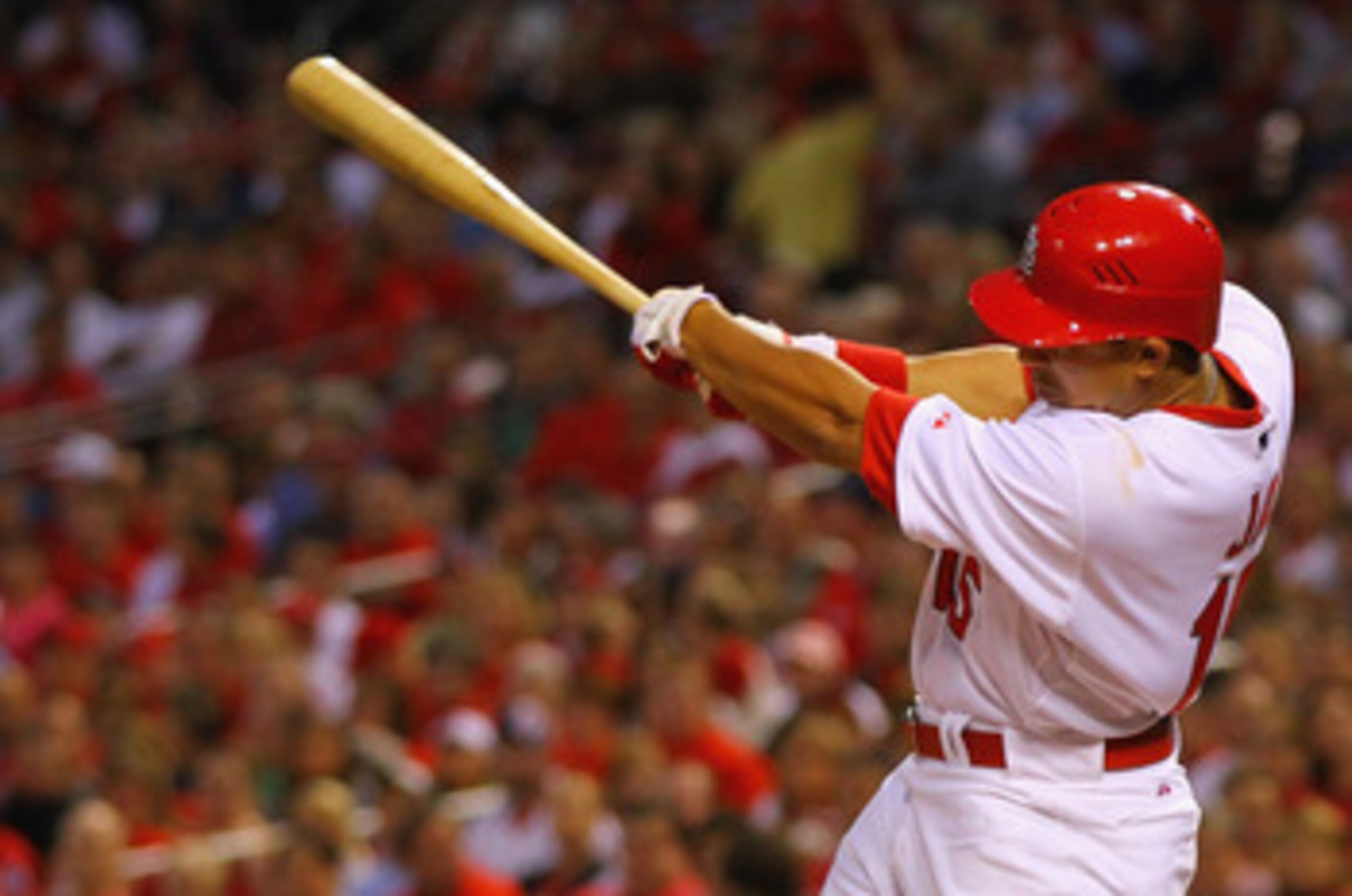 ST. LOUIS, MO - MAY 18: Jon Jay #15 of the St.Louis Cardinals hits a two-run single against the Houston Astros at Busch Stadium on May 18, 2011 in St. Louis, Missouri.  (Photo by Dilip Vishwanat/Getty Images)
