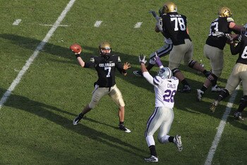 BOULDER, CO - NOVEMBER 20:  Quarterback Cody Hawkins #7 of the Colorado Buffaloes delivers a pass against linebacker Jerrell Childs #26 of the Kansas State Wildcats at Folsom Field on November 20, 2010 in Boulder, Colorado. Colorado defeated Kansas State 