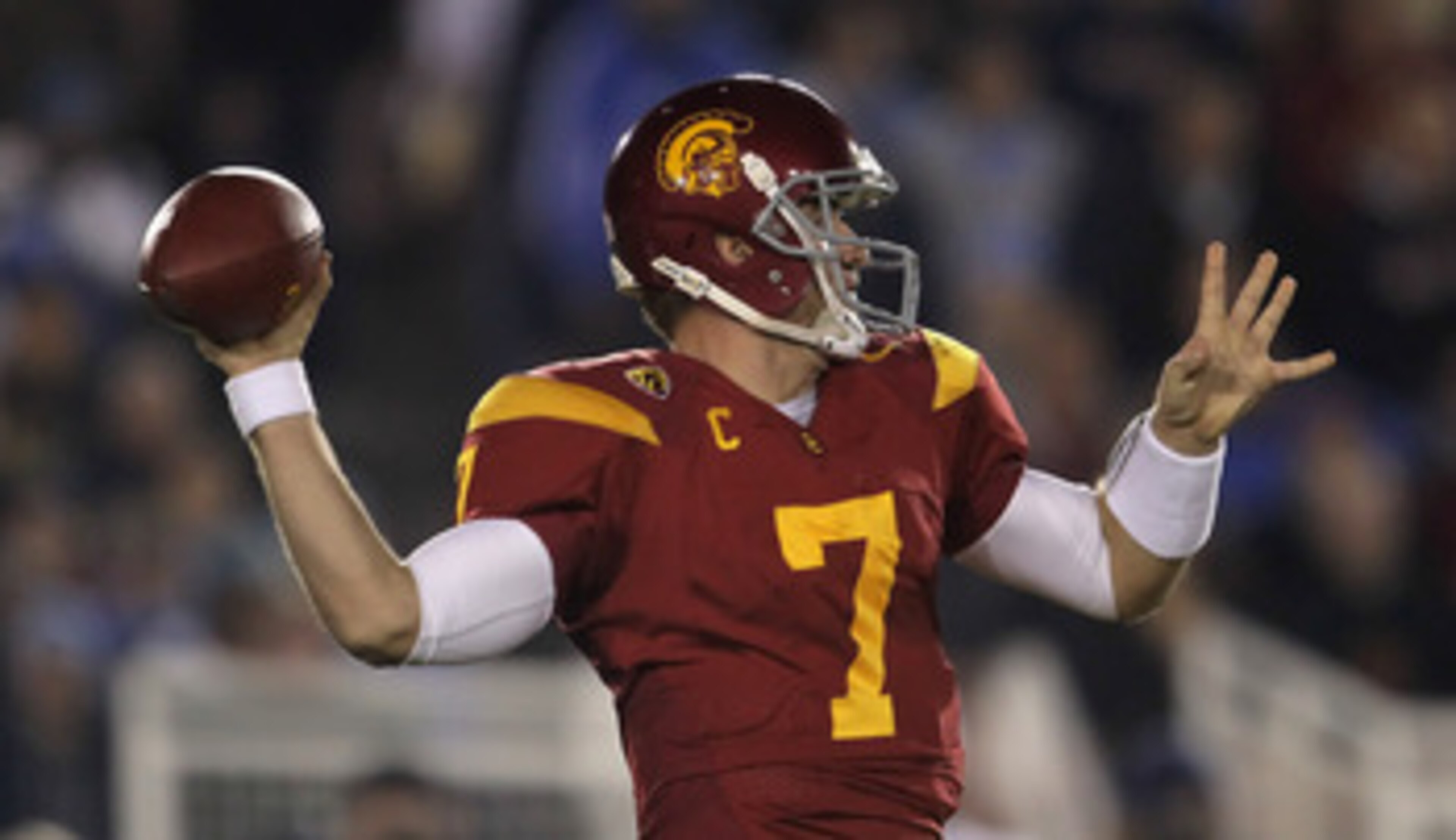 PASADENA, CA - DECEMBER 04:  Quarterback Matt Barkley #7 of the USC Trojans drops back to pass against the UCLA Bruins during the first half at the Rose Bowl on December 4, 2010 in Pasadena, California.  (Photo by Jeff Gross/Getty Images)