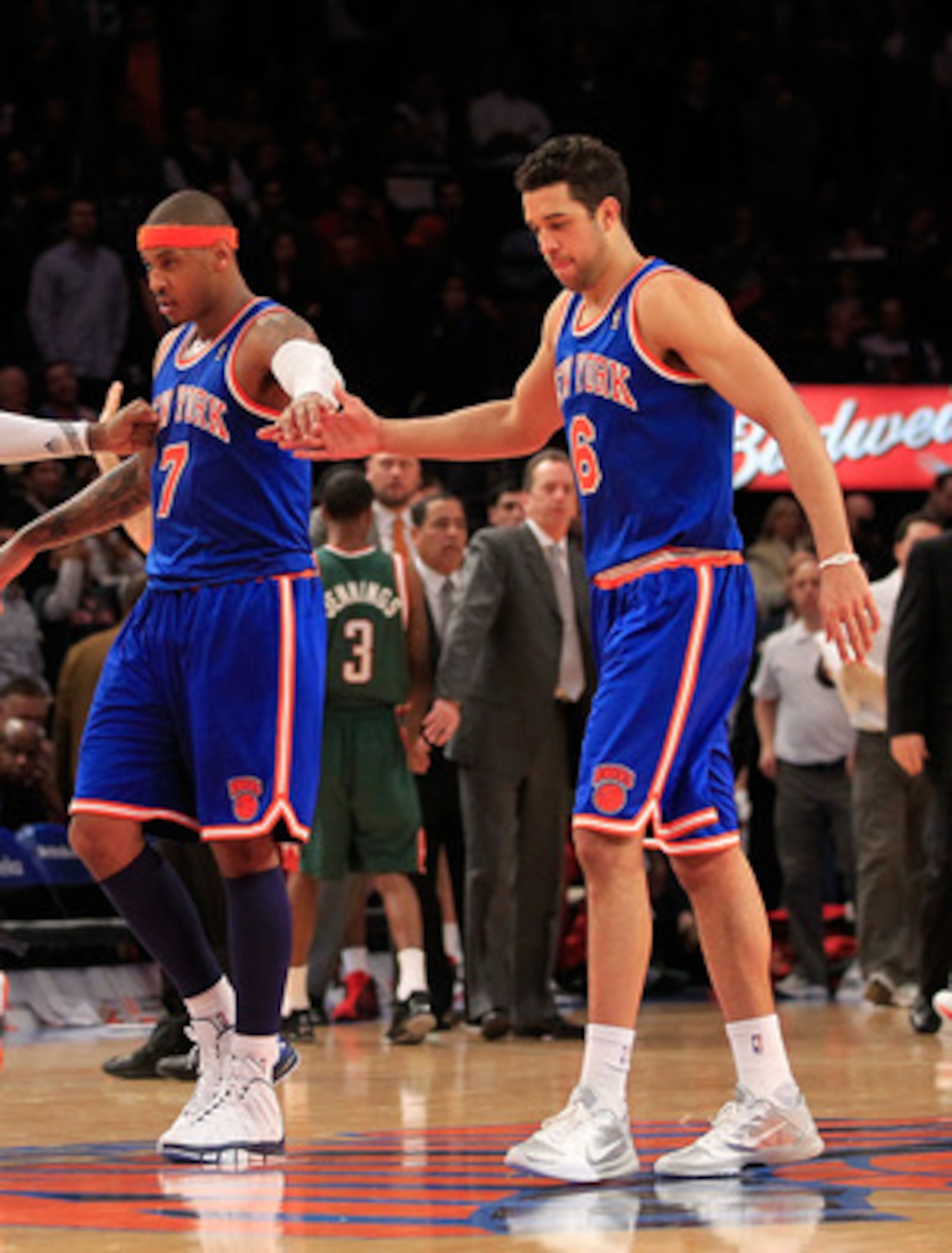 NEW YORK, NY - FEBRUARY 23:  Toney Douglas #23, Ronny Turiaf #14, Carmelo Anthony #7 and Landry Fields #6 of the New York Knicks leave the court for a timeout against the Milwaukee Bucks at Madison Square Garden on February 23, 2011 in New York City. NOTE