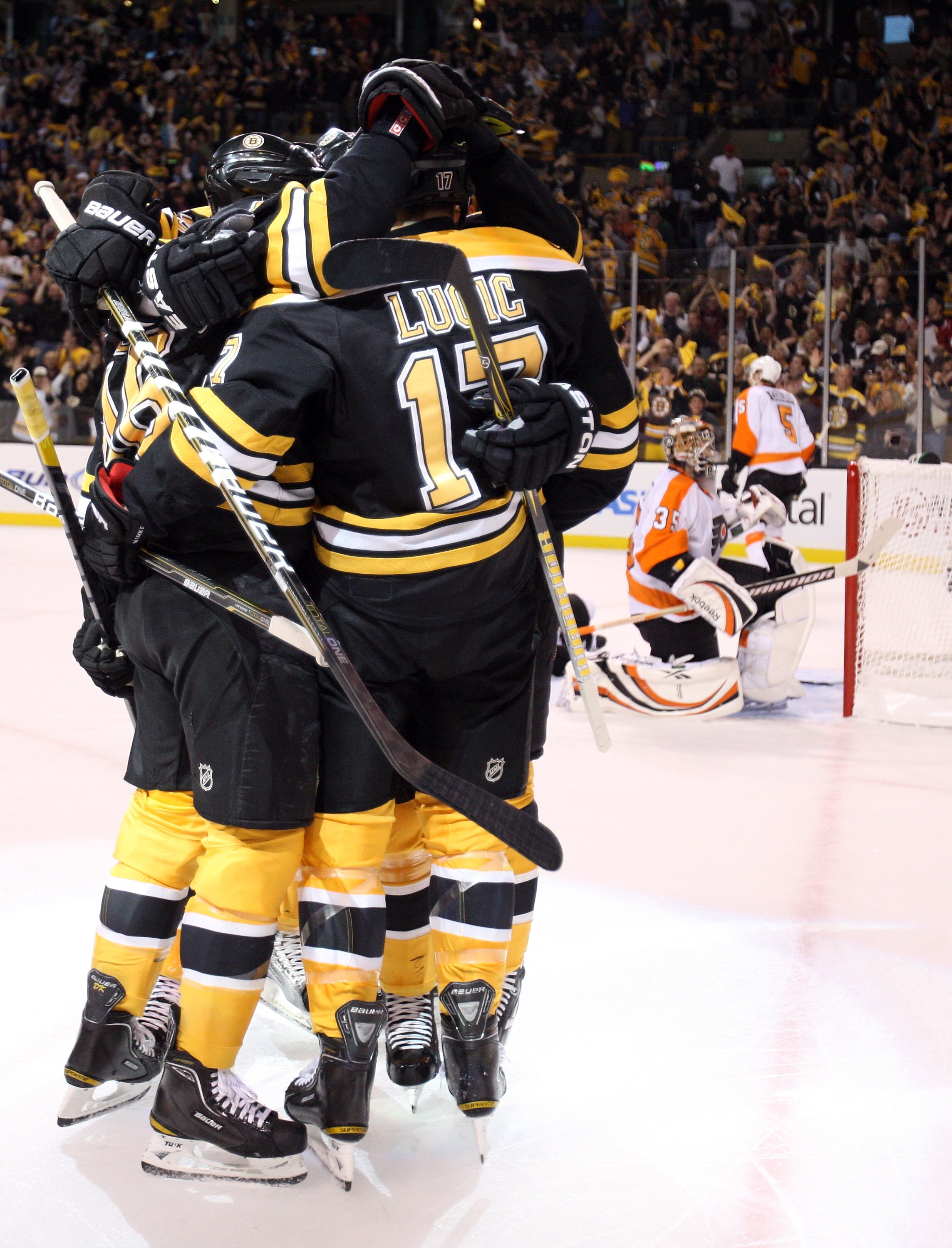 BOSTON, MA - MAY 06:  Milan Lucic #17 of the Boston Bruins is congratulated by teammates after he scored a power play goal as Sergei Bobrovsky #35 of the Philadelphia Flyers stands by on Game Four of the Eastern Conference Semifinals during the 2011 NHL S