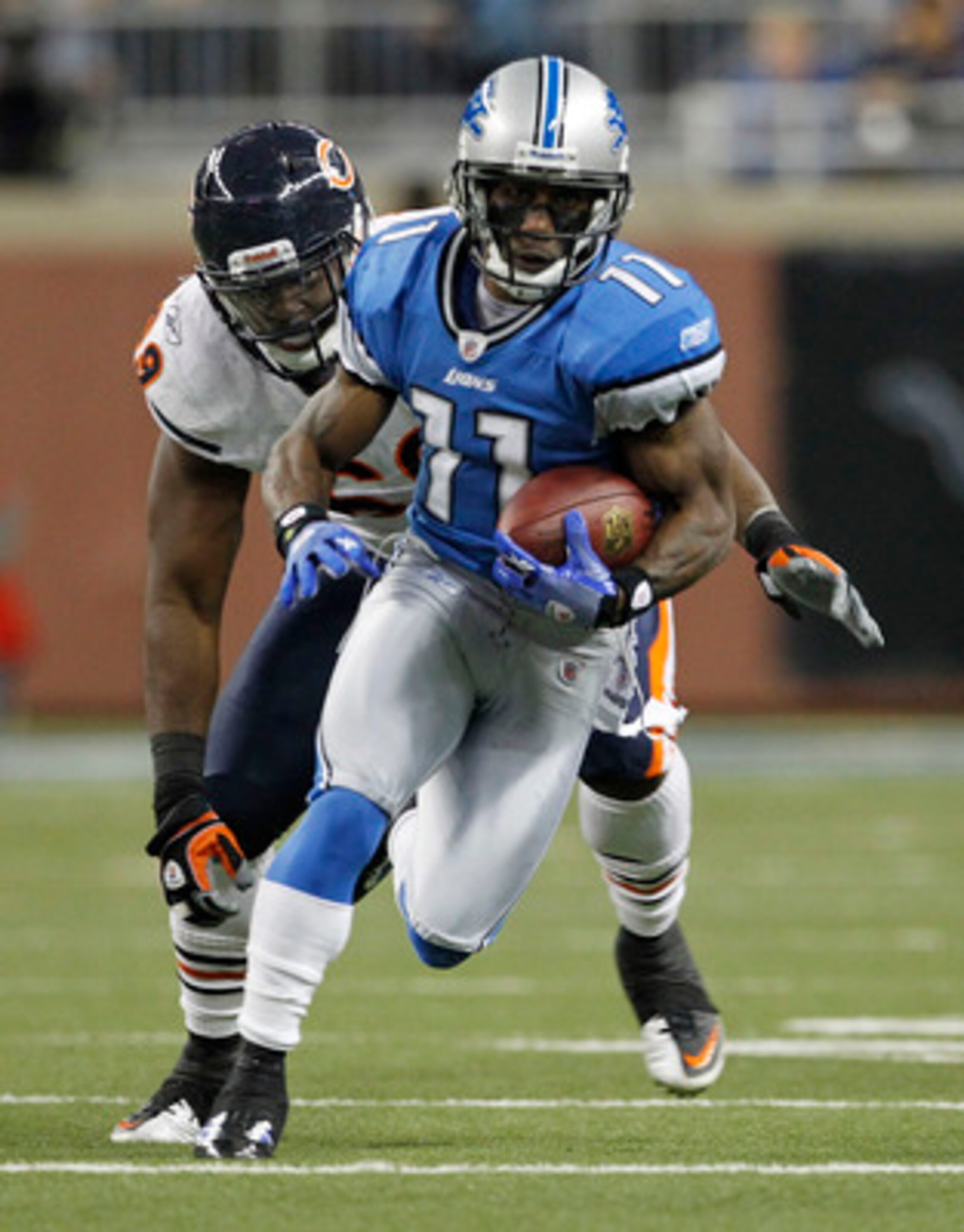 DETROIT - DECEMBER 05: Stefan Logan #11 of the Detroit Lions runs for a first down during the second quarter as Henry Melton #69 of the Chicago Bears give chase during the game at Ford Field on December 5, 2010 in Detroit, Michigan. (Photo by Leon Halip/ DETROIT - DECEMBER 05: Stefan Logan #11 of the Detroit Lions runs for a first down during the second quarter as Henry Melton #69 of the Chicago Bears give chase during the game at Ford Field on December 5, 2010 in Detroit, Michigan. (Photo by Leon Halip/