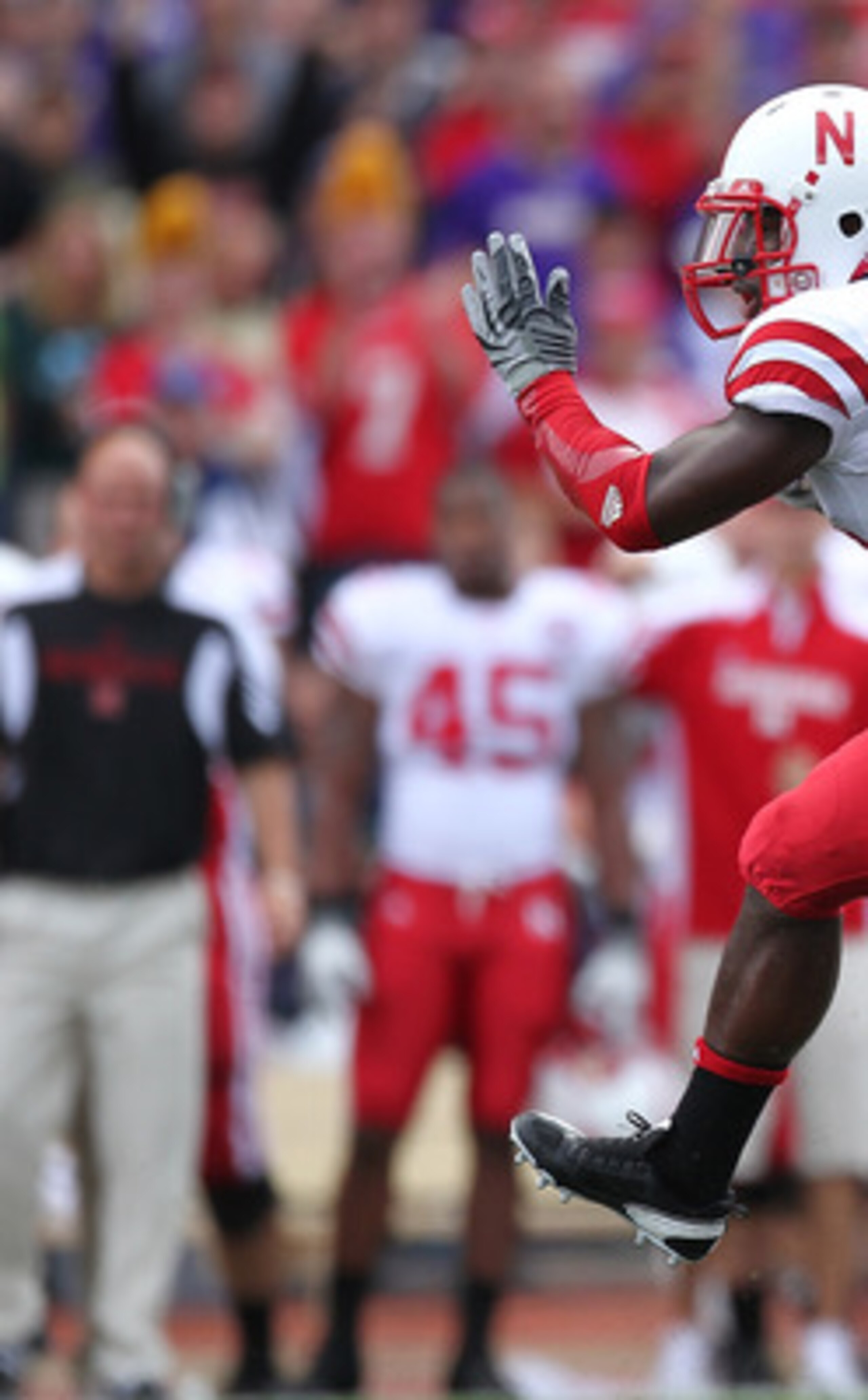 SEATTLE - SEPTEMBER 18:  Cornerback Alfonzo Dennard #15 of the Nebraska Cornhuskers returns an interception 31 yards for a touchdown in the third quarter against the Washington Huskies on September 18, 2010 at Husky Stadium in Seattle, Washington. The Cor