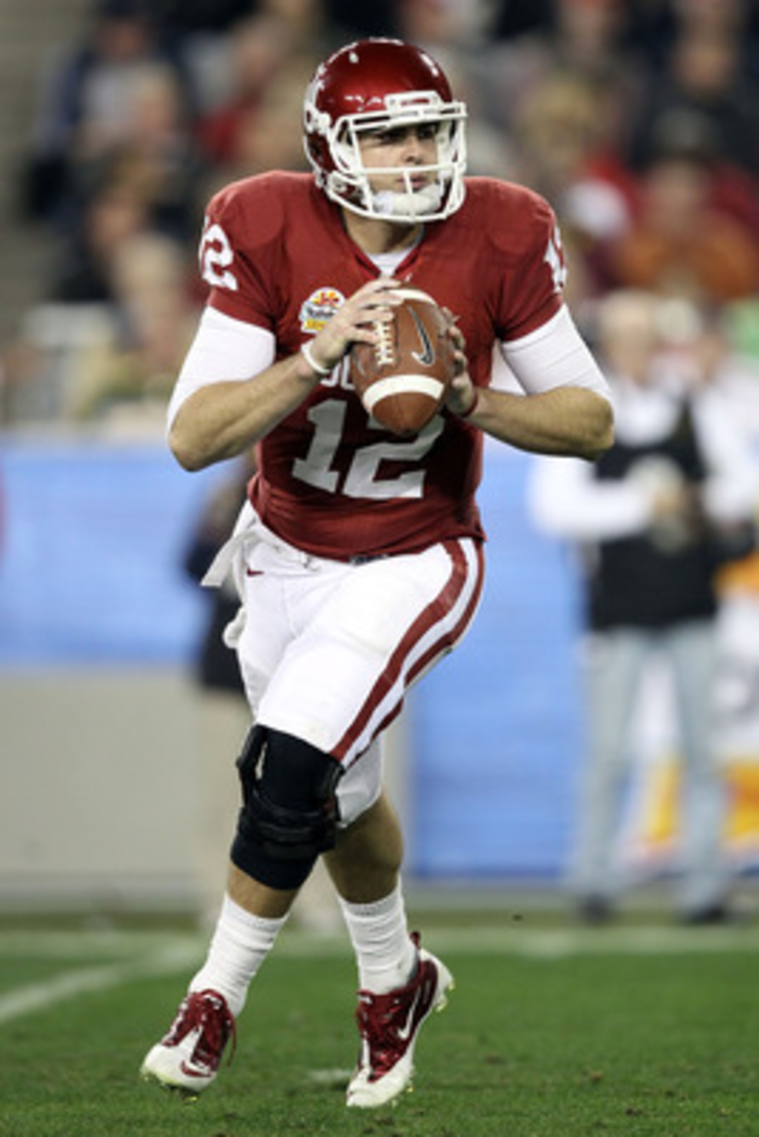 GLENDALE, AZ - JANUARY 01:  Landry Jones #12 of the Oklahoma Sooners throws the ball against the Connecticut Huskies during the Tostitos Fiesta Bowl at the Universtity of Phoenix Stadium on January 1, 2011 in Glendale, Arizona.  (Photo by Christian Peters