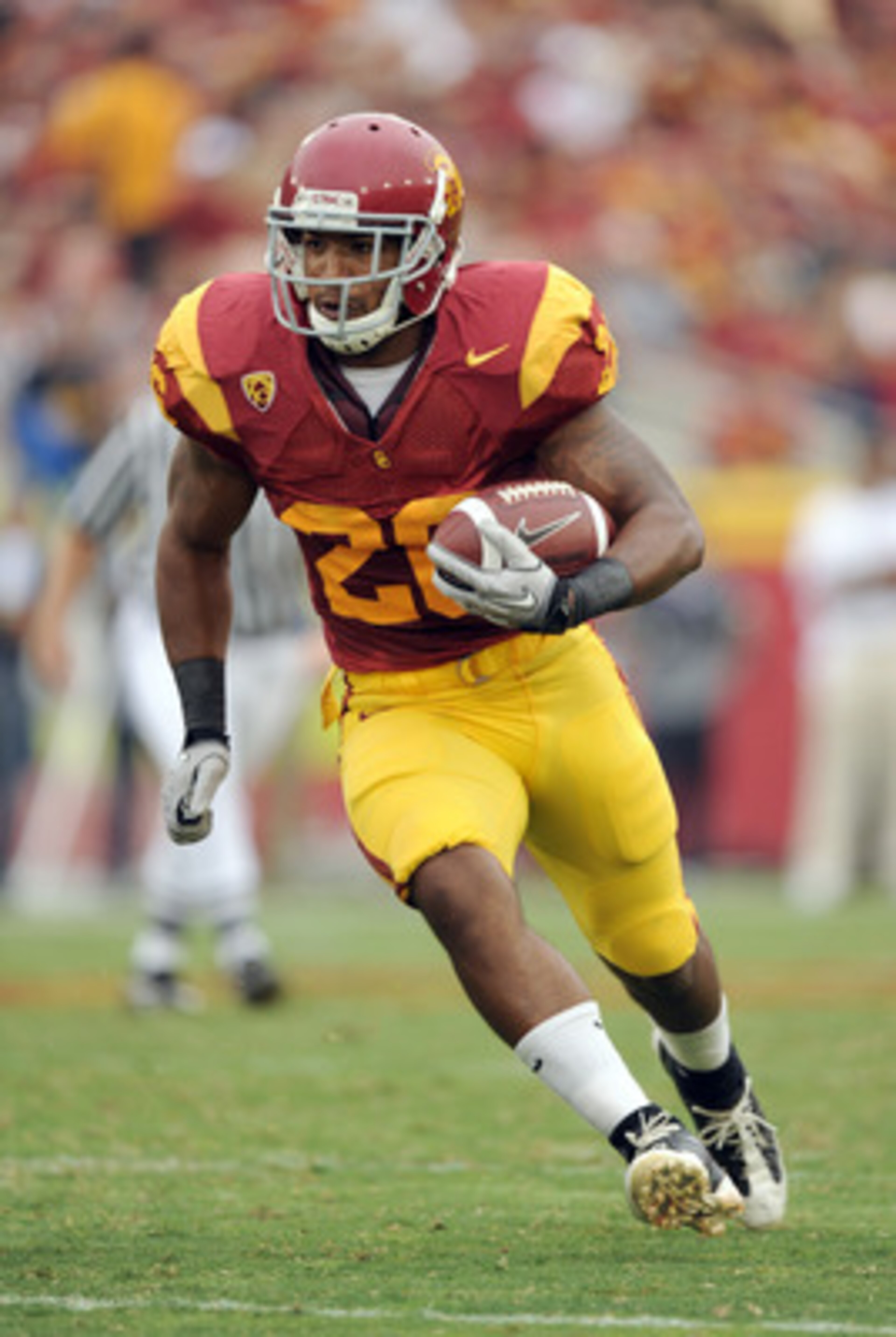 LOS ANGELES, CA - OCTOBER 16:  Marc Tyler #26 of the USC Trojans rushes the ball during the game against the California Golden Bears at Los Angeles Memorial Coliseum on October 16, 2010 in Los Angeles, California.  (Photo by Harry How/Getty Images)