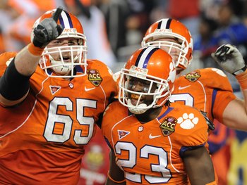 TAMPA, FL - NOVEMBER 28: Running back Andre Ellington #23 of the Clemson Tigers celebrates a touchdown run with guard Thomas Austin #65 against the Georgia Tech Yellow Jackets in the 2009 ACC Football Championship Game December 5, 2009 at Raymond James St