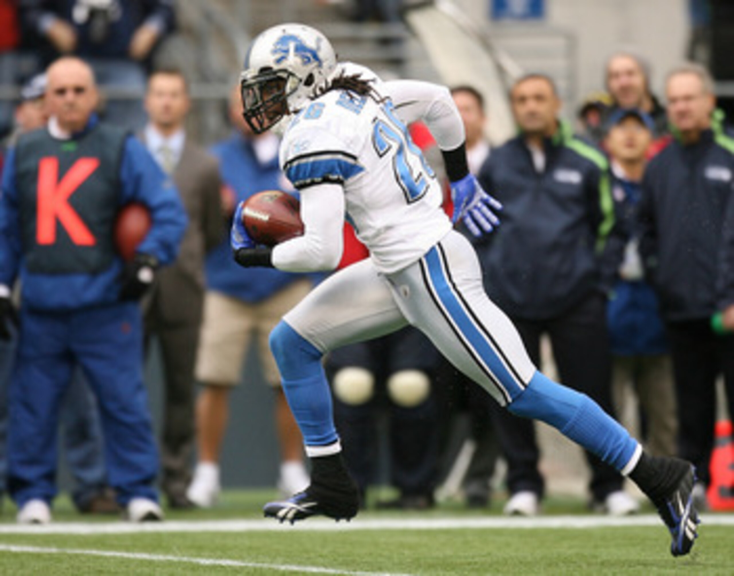 SEATTLE - NOVEMBER 08:  Safety Louis Delmas #26 of the Detroit Lions returns an interception for 29 yards against the Seattle Seahawks on November 8, 2009 at Qwest Field in Seattle, Washington. The Seahawks defeated the Lions 32-20. (Photo by Otto Greule 
