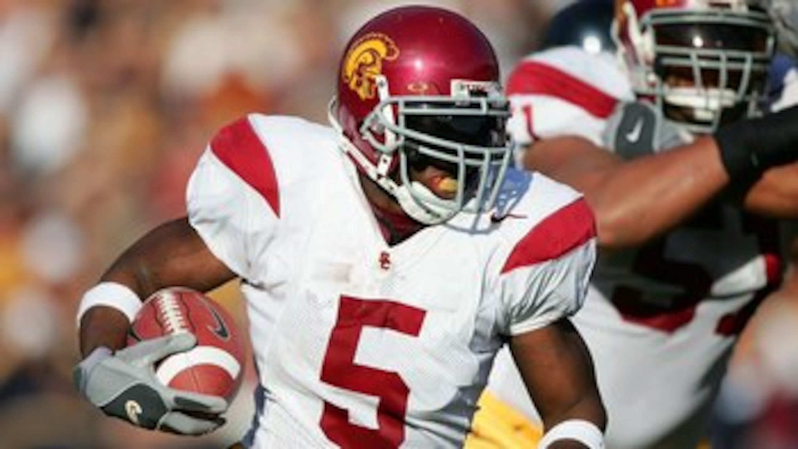 BERKELEY, CA - NOVEMBER 12:  (FILE PHOTO) Reggie Bush #5 of the USC Trojans runs with the ball against the California Golden Bears at Memorial Stadium on November 12th, 2005 in Berkeley, California. Bush was picked second overall by the New Orleans Saints