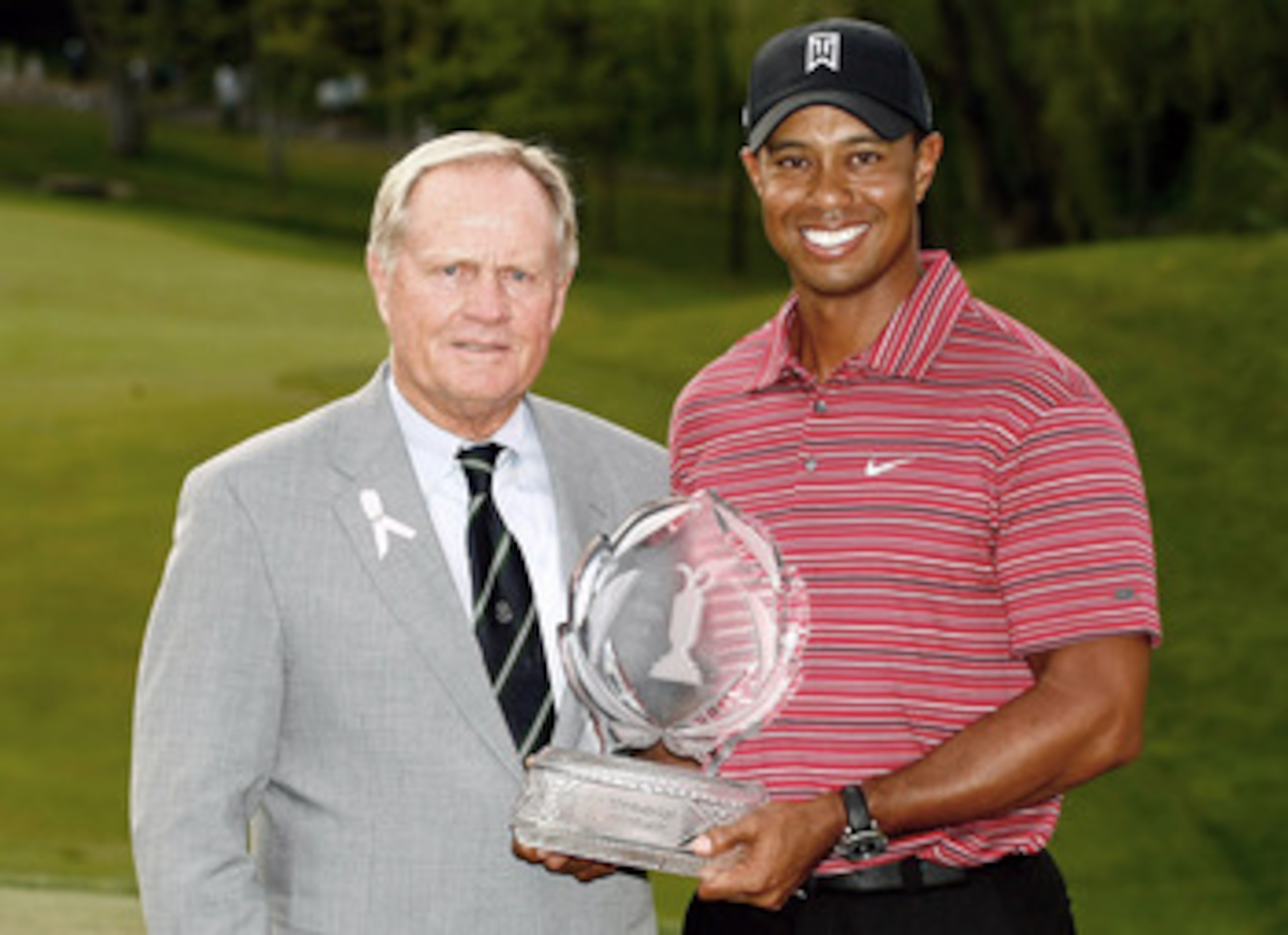 DUBLIN, OH - JUNE 07: Jack Nicklaus presents Tiger Woods with the trophy after his one-stroke victory at the Memorial Tournament at the Muirfield Village Golf Club on June 7, 2009 in Dublin, Ohio. (Photo by Scott Halleran/Getty Images)