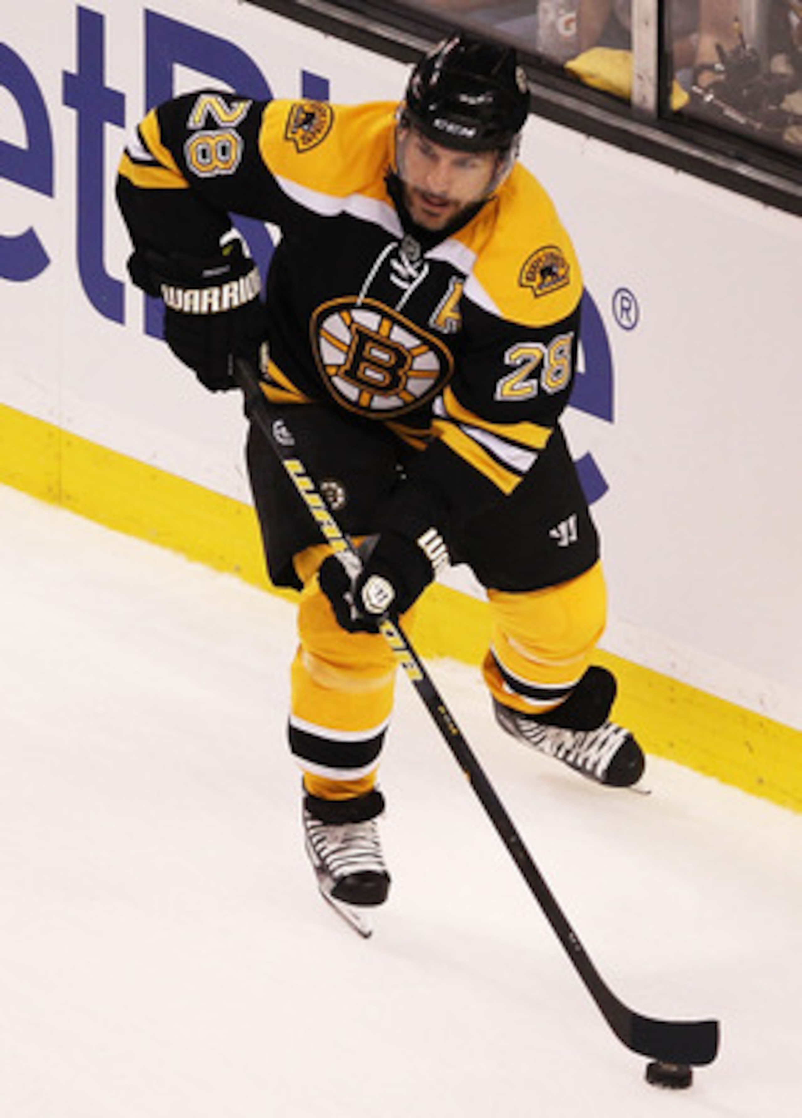 BOSTON, MA - MAY 17:  Mark Recchi #28 of the Boston Bruins controls the puck against the Tampa Bay Lightning in Game Two of the Eastern Conference Finals during the 2011 NHL Stanley Cup Playoffs at TD Garden on May 17, 2011 in Boston, Massachusetts.  (Pho