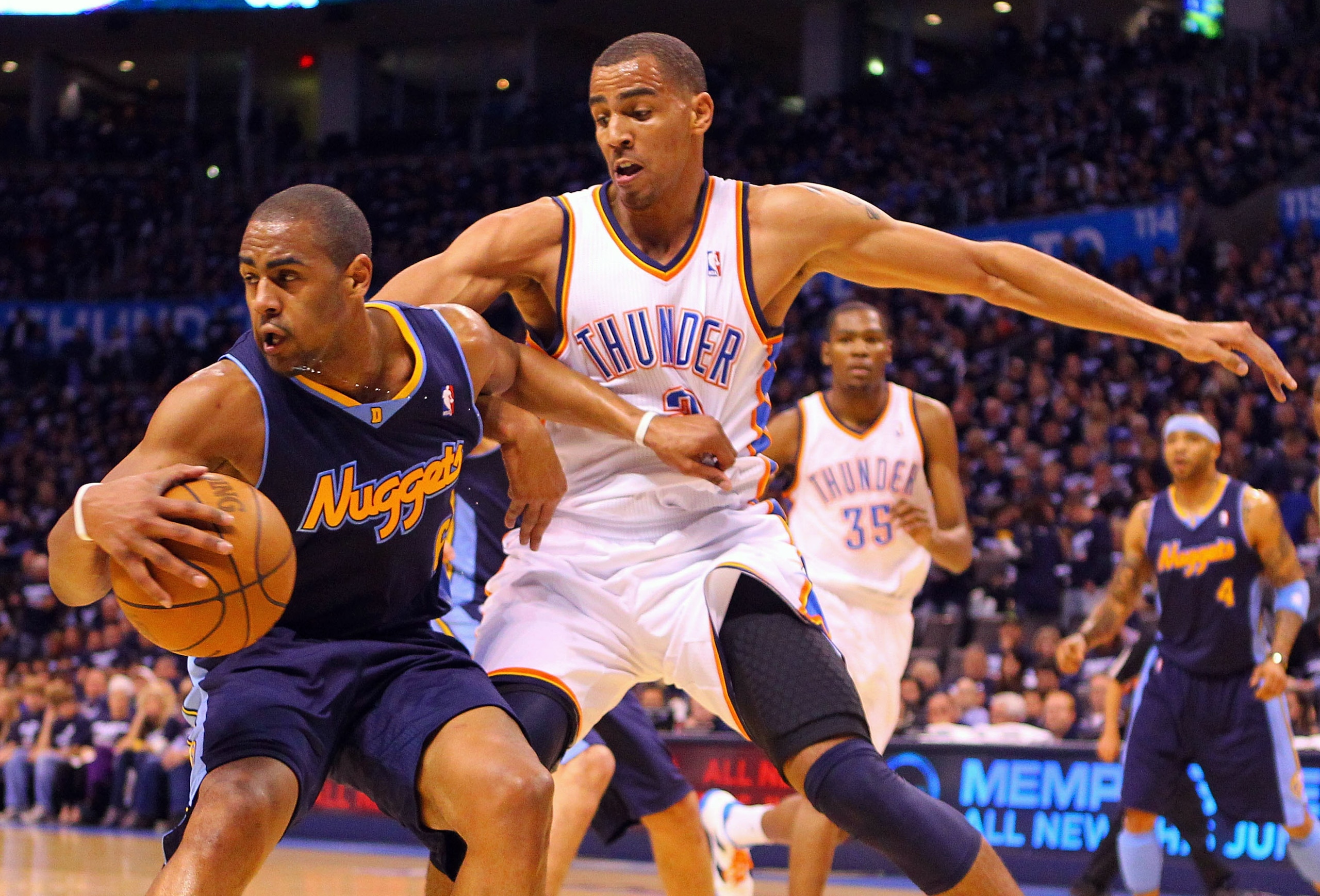 OKLAHOMA CITY, OK - APRIL 27: Arron Afflalo #6 of the Denver Nuggets looks to get past Thabo Sefolosha #2 of the Oklahoma City Thunder in Game Five of the Western Conference Quarterfinals in the 2011 NBA Playoffs on April 27, 2011 at the Ford Center in Ok