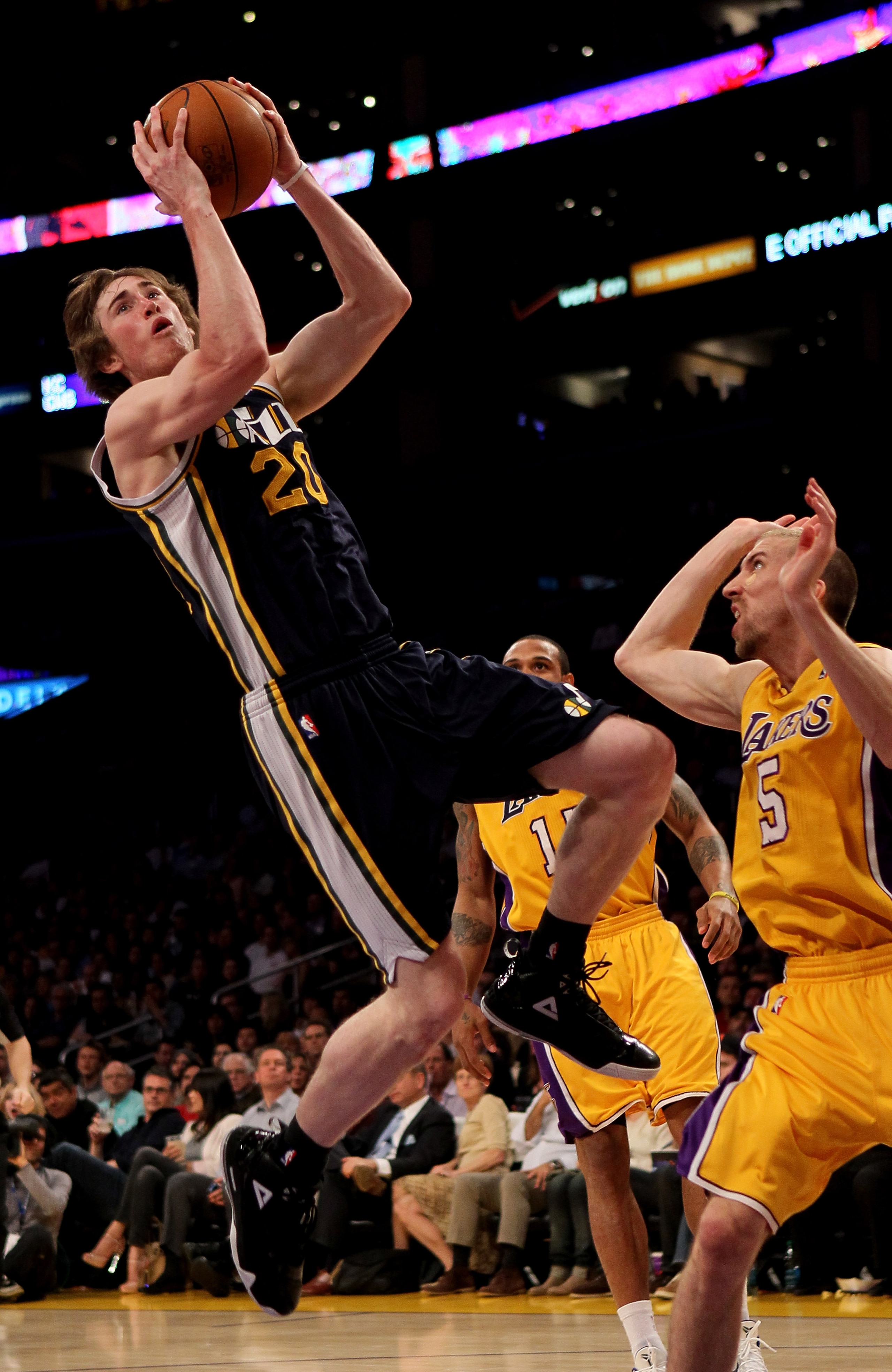 LOS ANGELES, CA - APRIL 05:  Gordon Hayward #20 of the Utah Jazz shoots over Steve Blake #5 of the Los Angeles Lakers at Staples Center on April 5, 2011 in Los Angeles, California. The Jazz won 86-85.  NOTE TO USER: User expressly acknowledges and agrees
