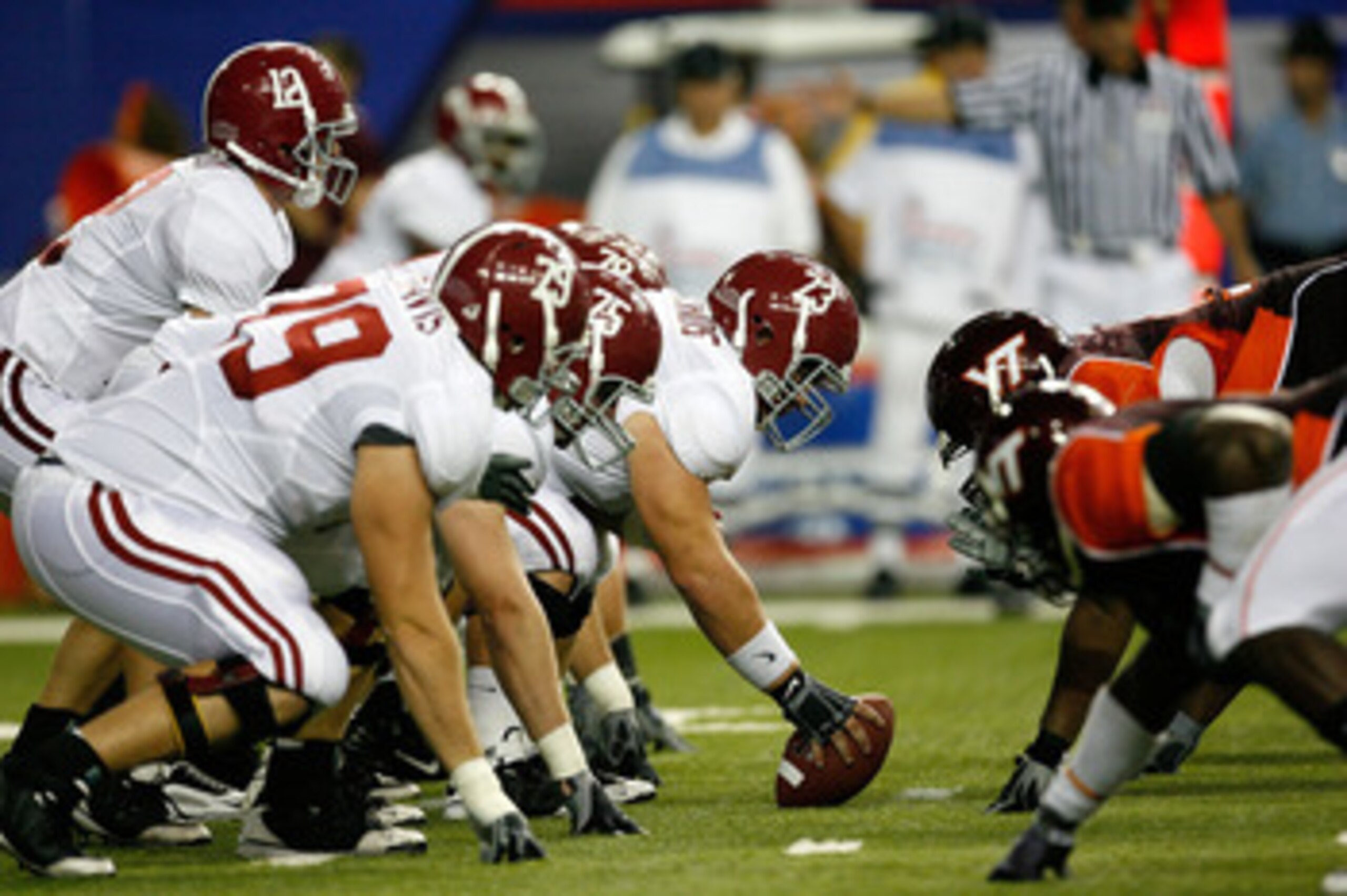 ATLANTA - SEPTEMBER 05: Quarterback Greg McElroy #12 of the Alabama Crimson Tide takes the snap from William Vlachos #73 against the Virginia Tech Hokies during the Chick-fil-A Kickoff Game at Georgia Dome on September 5, 2009 in Atlanta, Georgia. (Phot ATLANTA - SEPTEMBER 05: Quarterback Greg McElroy #12 of the Alabama Crimson Tide takes the snap from William Vlachos #73 against the Virginia Tech Hokies during the Chick-fil-A Kickoff Game at Georgia Dome on September 5, 2009 in Atlanta, Georgia. (Phot