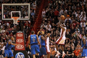 MIAMI, FL - DECEMBER 20:  LeBron James #6 of the Miami Heat shoots a jumpshot during a game against the Dallas Mavericks at American Airlines Arena on December 20, 2010 in Miami, Florida. NOTE TO USER: User expressly acknowledges and agrees that, by downl