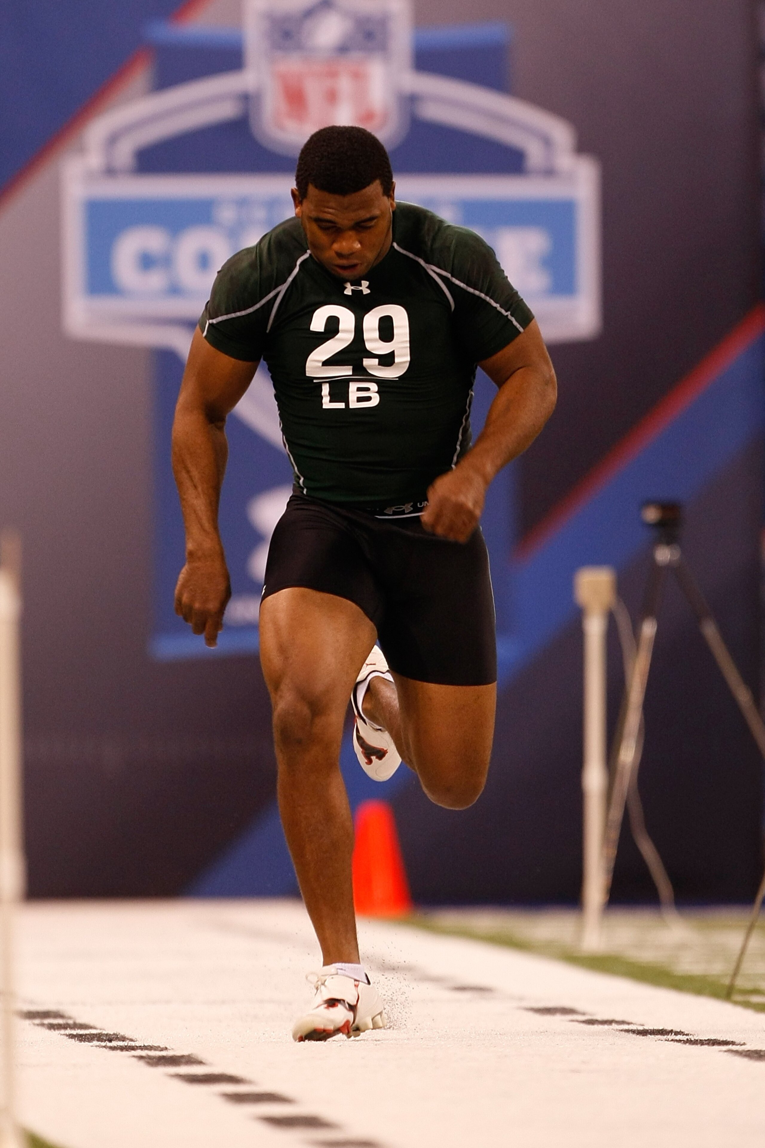 INDIANAPOLIS, IN - MARCH 1: Linebacker Darryl Sharpton of Miami runs the 40 yard dash during the NFL Scouting Combine presented by Under Armour at Lucas Oil Stadium on March 1, 2010 in Indianapolis, Indiana. (Photo by Scott Boehm/Getty Images)