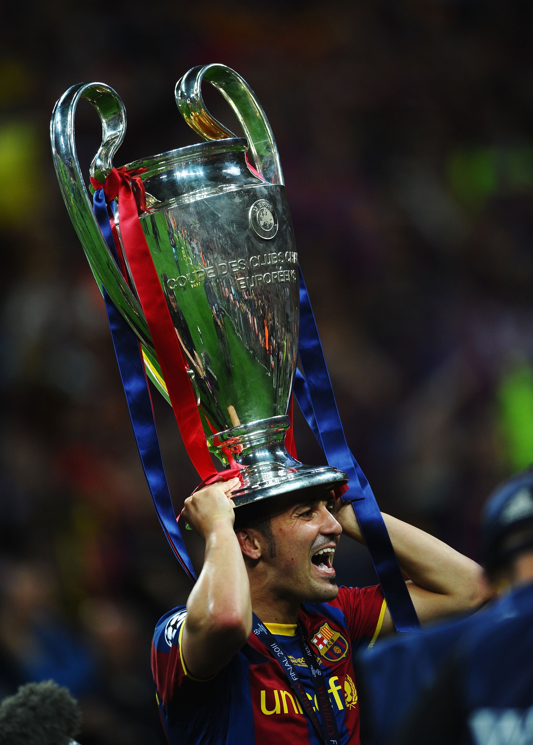 LONDON, ENGLAND - MAY 28:  David Villa of FC Barcelona wears the trophy on his head after victory in UEFA Champions League final between FC Barcelona and Manchester United FC at Wembley Stadium on May 28, 2011 in London, England.  (Photo by Laurence Griff