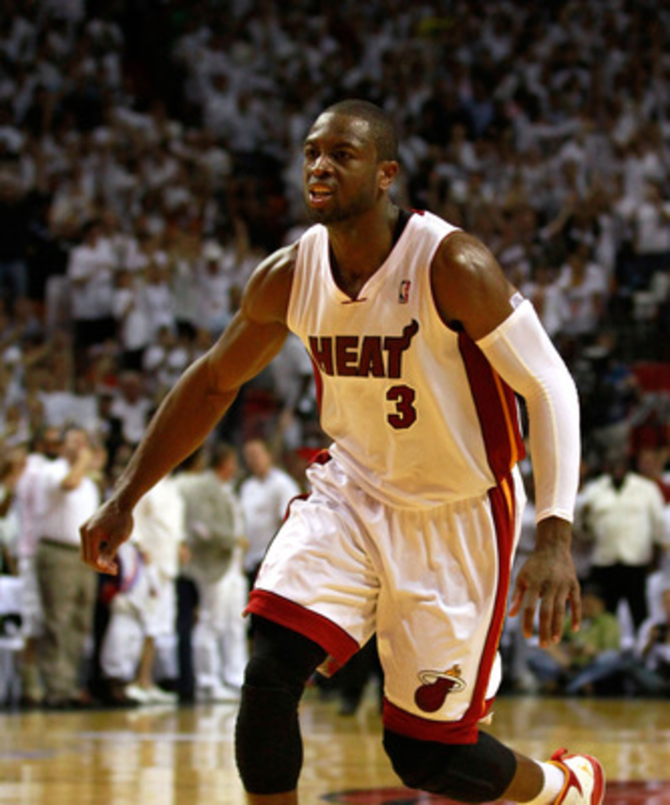 MIAMI, FL - MAY 24:  Dwyane Wade #3 of the Miami Heat reacts against the Chicago Bulls in Game Four of the Eastern Conference Finals during the 2011 NBA Playoffs on May 24, 2011 at American Airlines Arena in Miami, Florida. Recording artist Drake NOTE TO