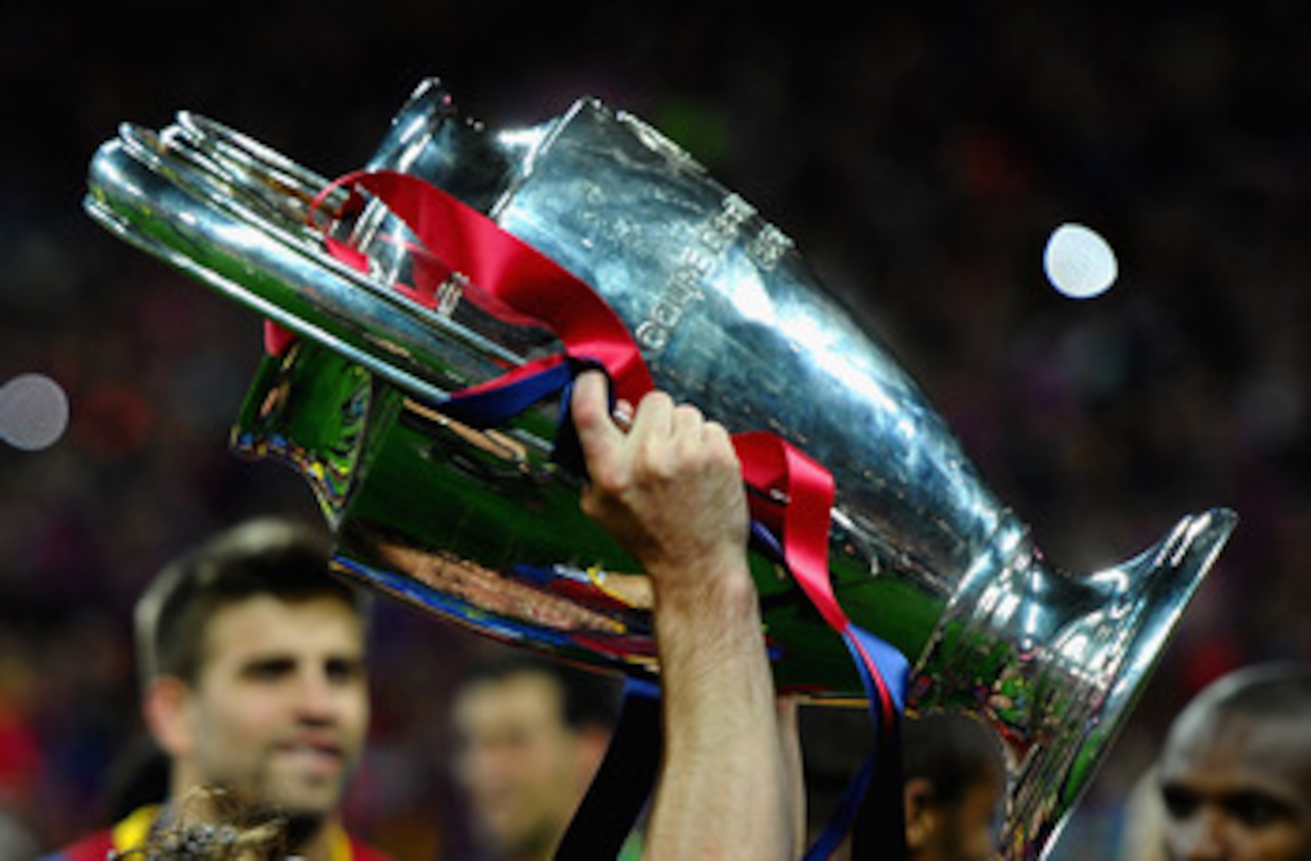 LONDON, ENGLAND - MAY 28: Lionel Messi of FC Barcelona celebrates with the trophy after victory during the UEFA Champions League final between FC Barcelona and Manchester United FC at Wembley Stadium on May 28, 2011 in London, England.  (Photo by Laurence