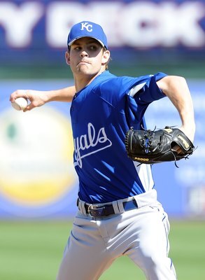 SURPRISE, AZ - MARCH 06:  Aaron Crow #43 of the Kansas City Royals pitches during a Spring Training game against the Texas Rangers on March 6, 2010 in Surprise, Arizona.  (Photo by Lisa Blumenfeld/Getty Images)