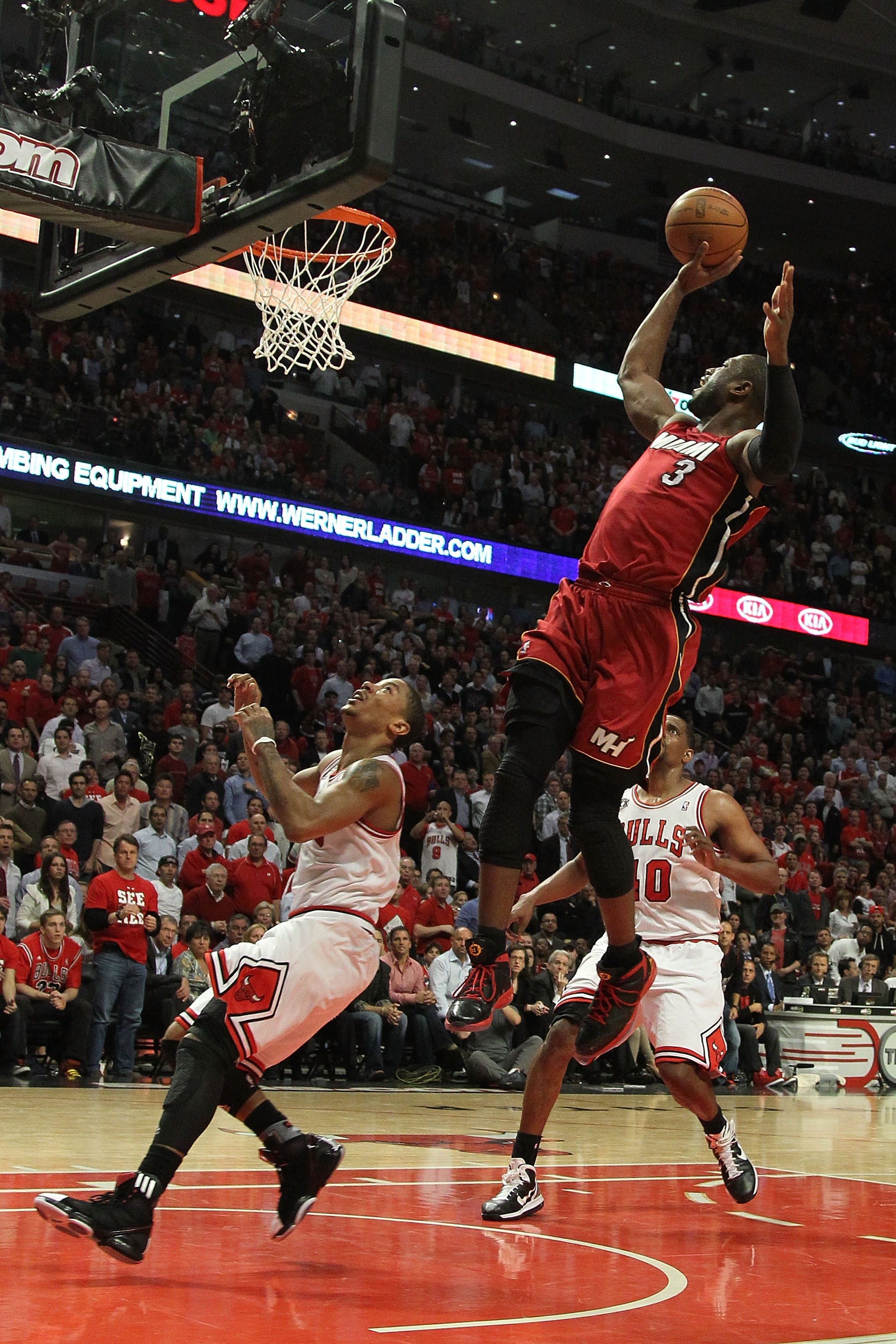 CHICAGO, IL - MAY 26:  Dwyane Wade #3 of the Miami Heat drives for a shot attempt against Derrick Rose #1 of the Chicago Bulls in Game Five of the Eastern Conference Finals during the 2011 NBA Playoffs on May 26, 2011 at the United Center in Chicago, Illi