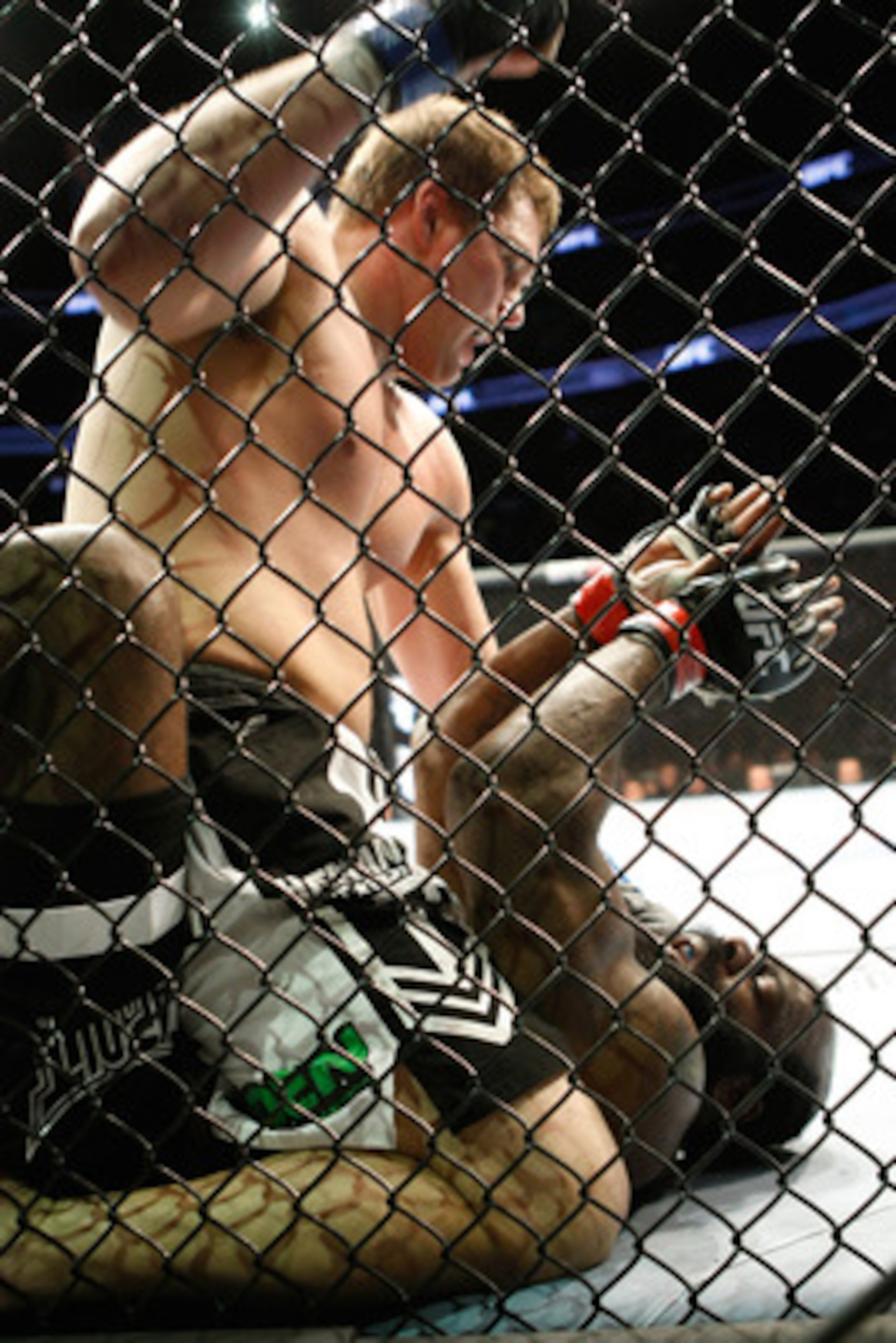 MONTREAL- MAY 8: Matt Mitrione (top) punches Kimbo Slice in their heavyweight bout at UFC 113 at Bell Centre on May 8, 2010 in Montreal, Quebec, Canada. Matt Mitrione won the bout by KO. (Photo by Richard Wolowicz/Getty Images)