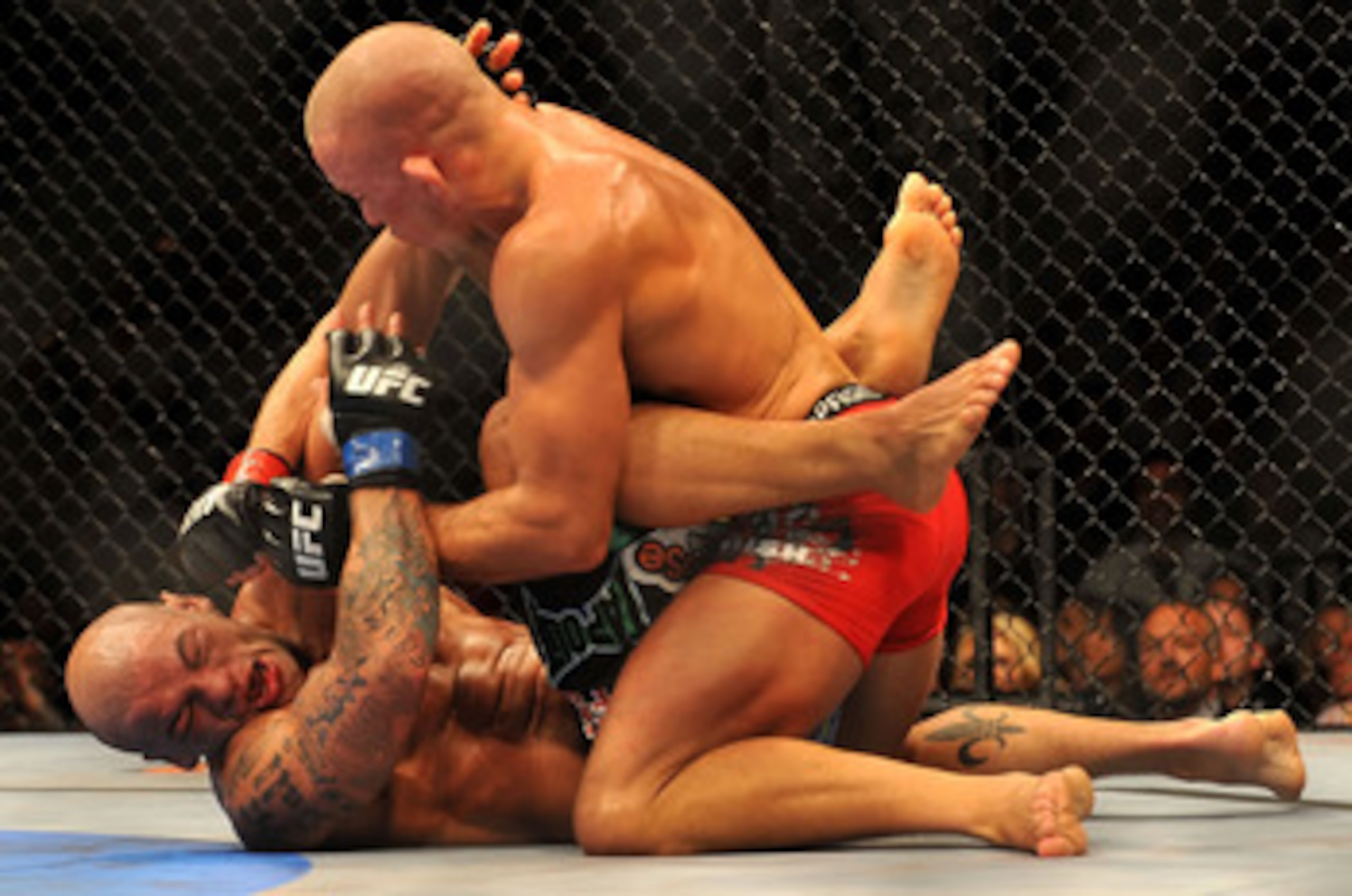 LAS VEGAS - JULY 11:  (Top) Georges St. Pierre battles Thiago Alves during their welterweight title bout during UFC 100 on July 11, 2009 in Las Vegas, Nevada.  (Photo by Jon Kopaloff/Getty Images)
