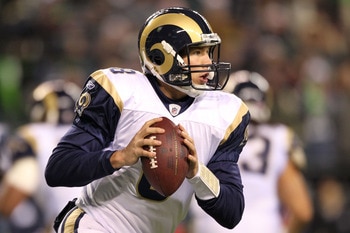 SEATTLE, WA - JANUARY 02:  Quarterback Sam Bradford #8 of the St. Louis Rams looks to pass against the Seattle Seahawks during their game at Qwest Field on January 2, 2011 in Seattle, Washington.  (Photo by Otto Greule Jr/Getty Images)