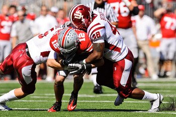 COLUMBUS, OH - OCTOBER 9:  Leon Beckum #48 of the Indiana Hoosiers assists on a tackle against the Ohio State Buckeyes at Ohio Stadium on October 9, 2010 in Columbus, Ohio.  (Photo by Jamie Sabau/Getty Images)