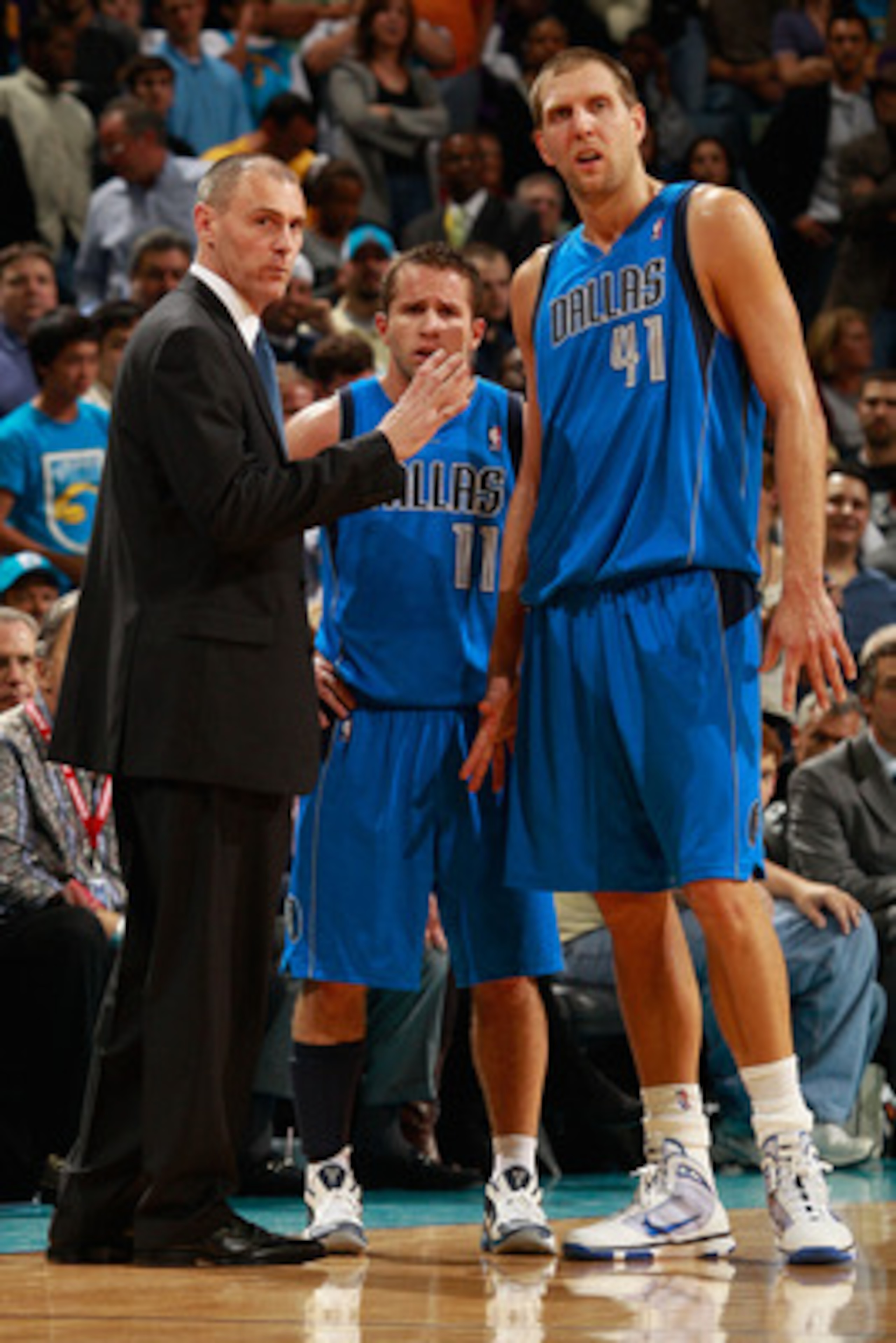 NEW ORLEANS - NOVEMBER 17:  Head coach Rick Carlisle talks with Jose Barea #11 and Dirk Nowitzki #41 of the Dallas Mavericks during a timeout against the New Orleans Hornets at the New Orleans Arena on November 17, 2010 in New Orleans, Louisiana.  The Hor