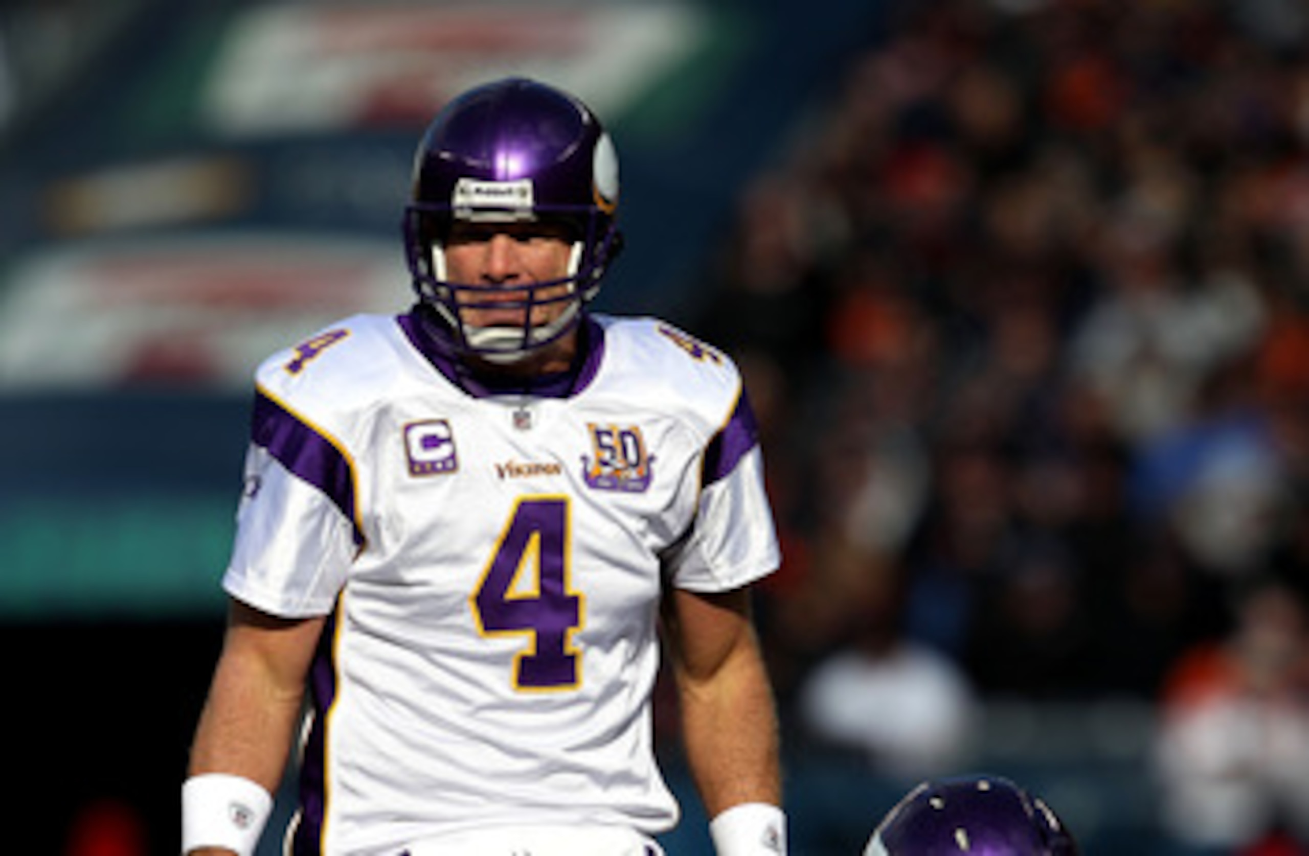 CHICAGO - NOVEMBER 14: Brett Favre #4 of the Minnesota Vikings looks over the Chicago Bear defense before taking the snap from Jon Cooper #68 at Soldier Field on November 14, 2010 in Chicago, Illinois. The Bears defeated the Vikings 27-13.  (Photo by Jona