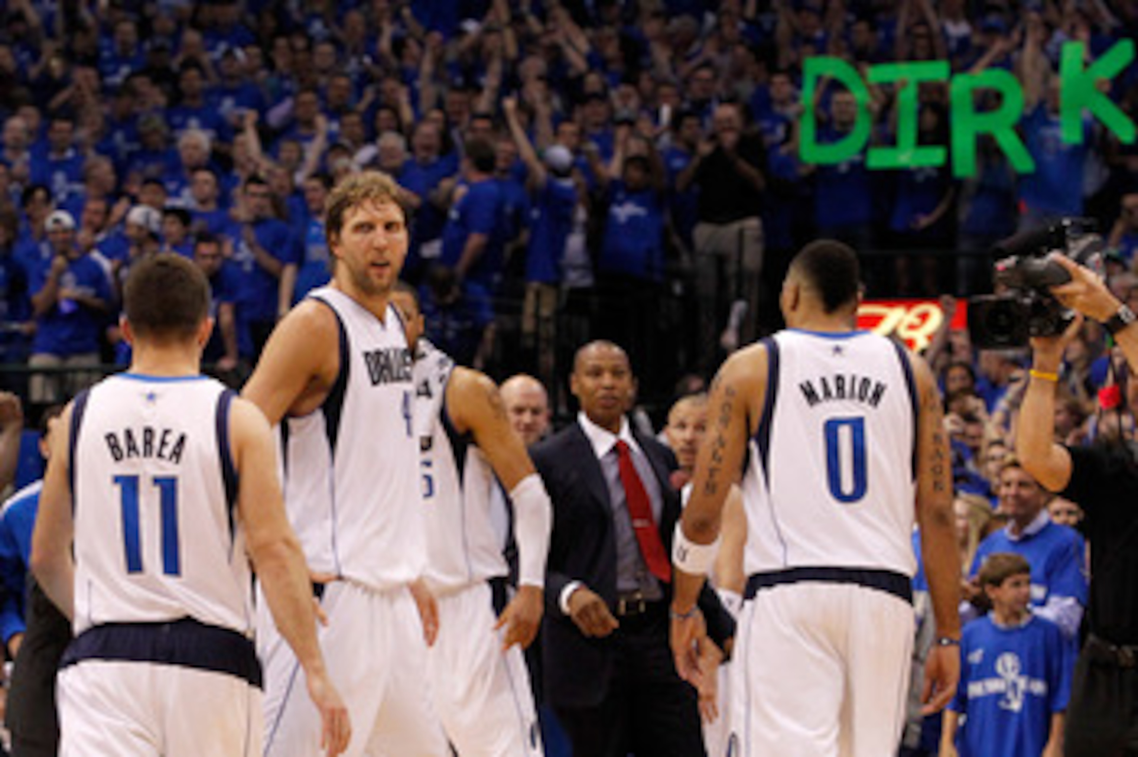 DALLAS, TX - MAY 25:  Dirk Nowitzki #41 of the Dallas Mavericks looks over at teammate Jose Juan Barea #11 late in the fourth quarter while taking on the Oklahoma City Thunder in Game Five of the Western Conference Finals during the 2011 NBA Playoffs at A