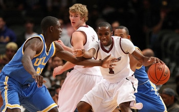 NEW YORK - NOVEMBER 21: Kevin Dillard #1 of the Southern Illinois Salukis dribbles against Jrue Holiday #21 of the UCLA Bruins on November 21, 2008 at Madison Square Garden in New York City.  (Photo by Nick Laham/Getty Images)