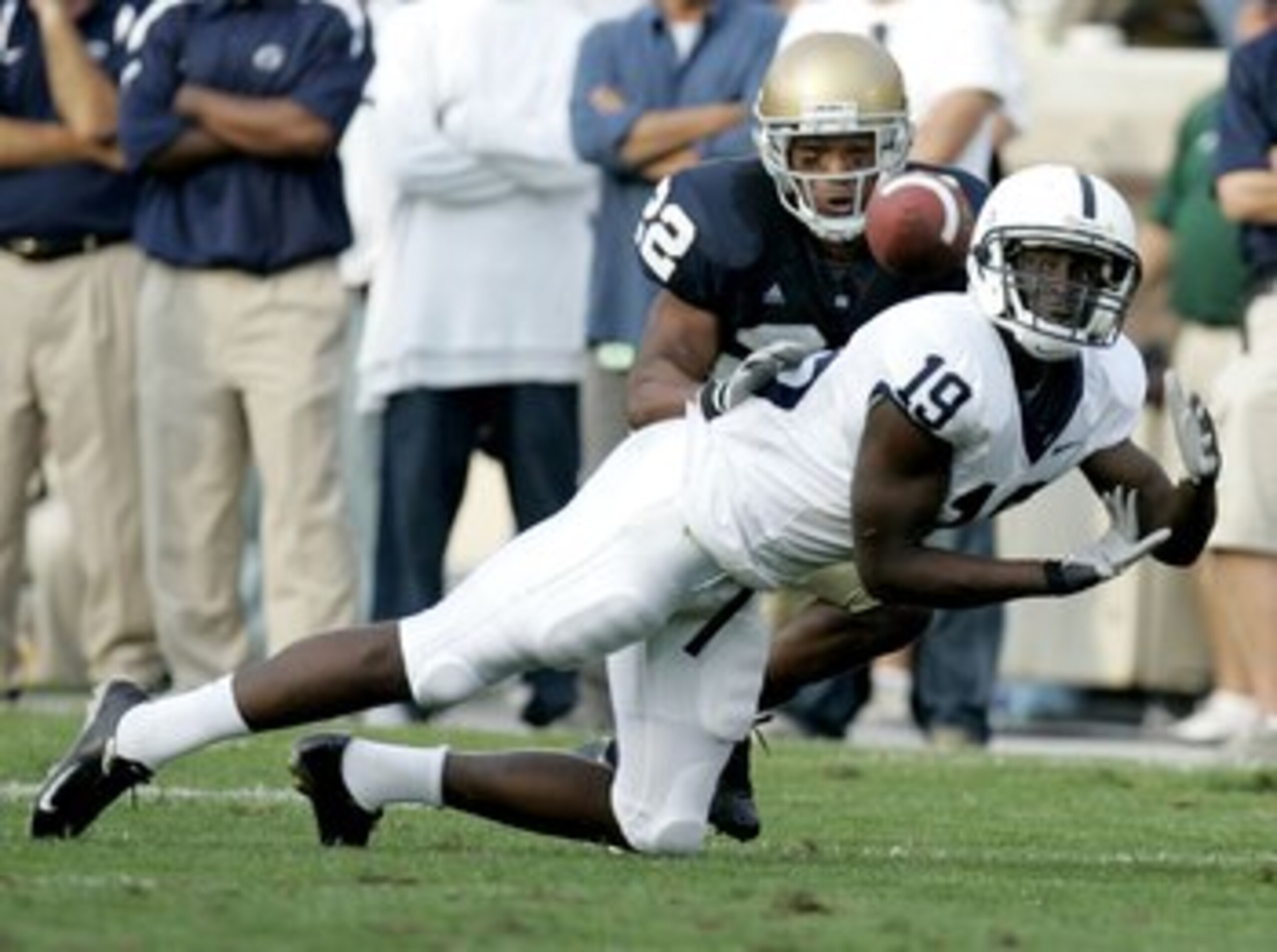 SOUTH BEND, IN - SEPTEMBER 09:  Chris Bell #19 of the Penn State Nittany Lions tries to make a third quarter catch in front of Ambrose Wooden#22 of the Notre Dame Fighting Irish on September 9, 2006 at Notre Dame Stadium in South Bend, Indiana. Notre Dame
