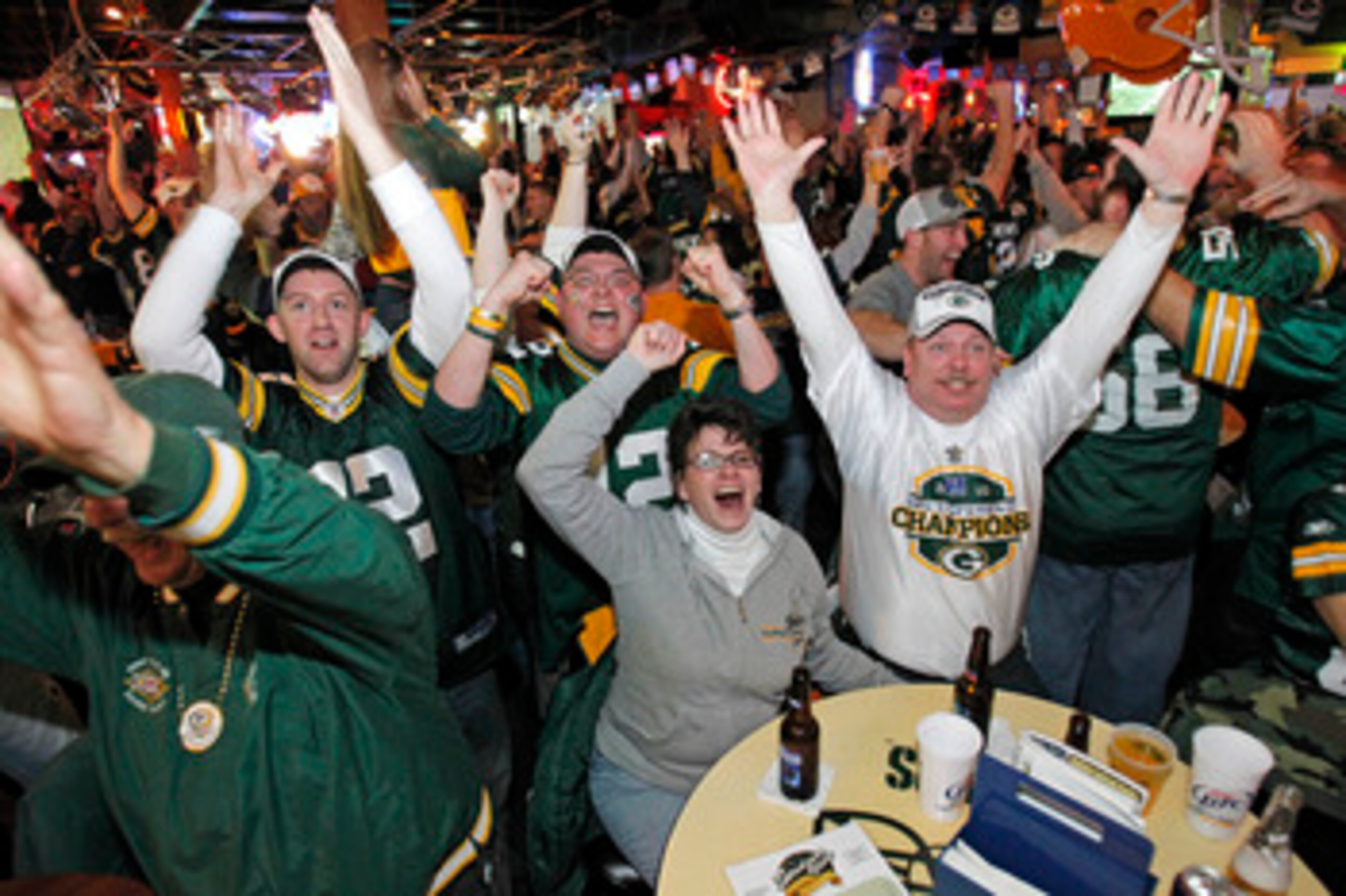 GREEN BAY, WI - FEBRUARY 06: Green Bay Packers fans react after watching the Green Bay Packers defeat the Pittsburgh Steelers in the Super Bowl at Stadium View Bar February 6, 2011 in Green Bay, Wisconsin.  (Photo by Matt Ludtke/Getty Images)