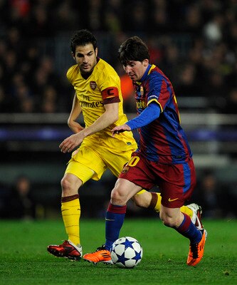 BARCELONA, SPAIN - MARCH 08:  Lionel Messi of FC Barcelona (R) duels for the ball against Cesc Fabregas of Arsenal during the UEFA Champions League round of 16 second leg match between Barcelona and Arsenal at the Camp Nou stadium on March 8, 2011 in Barc