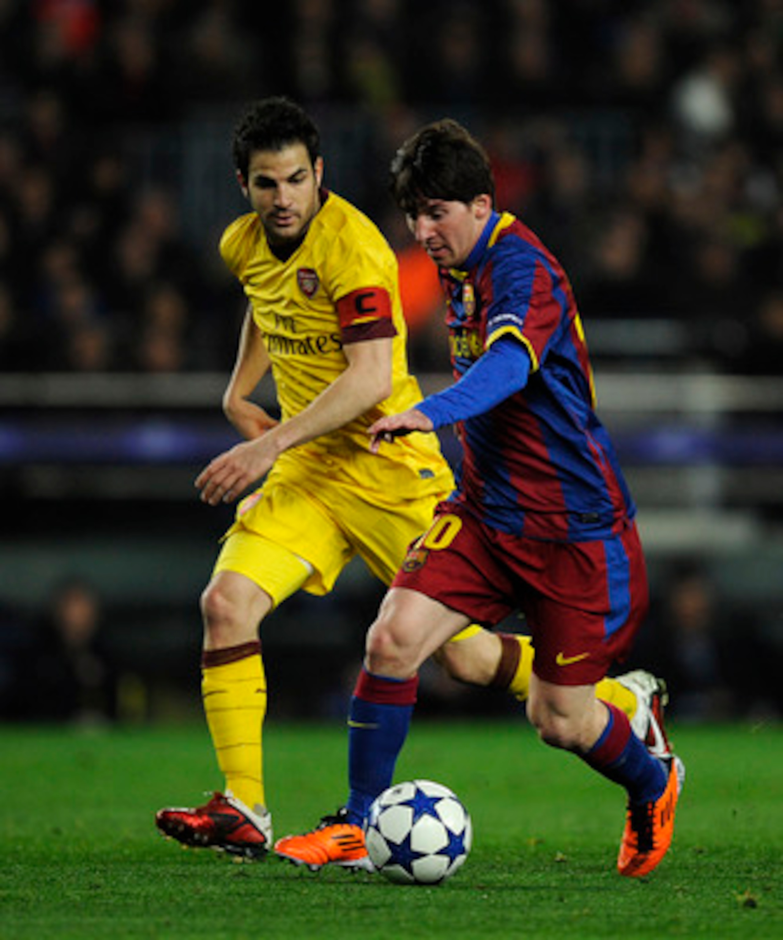 BARCELONA, SPAIN - MARCH 08:  Lionel Messi of FC Barcelona (R) duels for the ball against Cesc Fabregas of Arsenal during the UEFA Champions League round of 16 second leg match between Barcelona and Arsenal at the Camp Nou stadium on March 8, 2011 in Barc