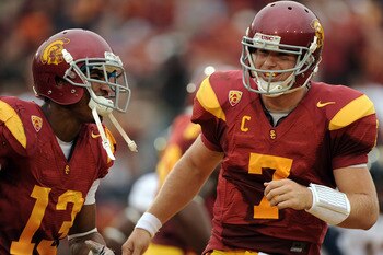 LOS ANGELES, CA - OCTOBER 16:  Matt Barkley #7 and Robert Woods #13 of the USC Trojans celebrate a touchdown for a 28-0 lead over the California Golden Bears during the second quarter at Los Angeles Memorial Coliseum on October 16, 2010 in Los Angeles, Ca
