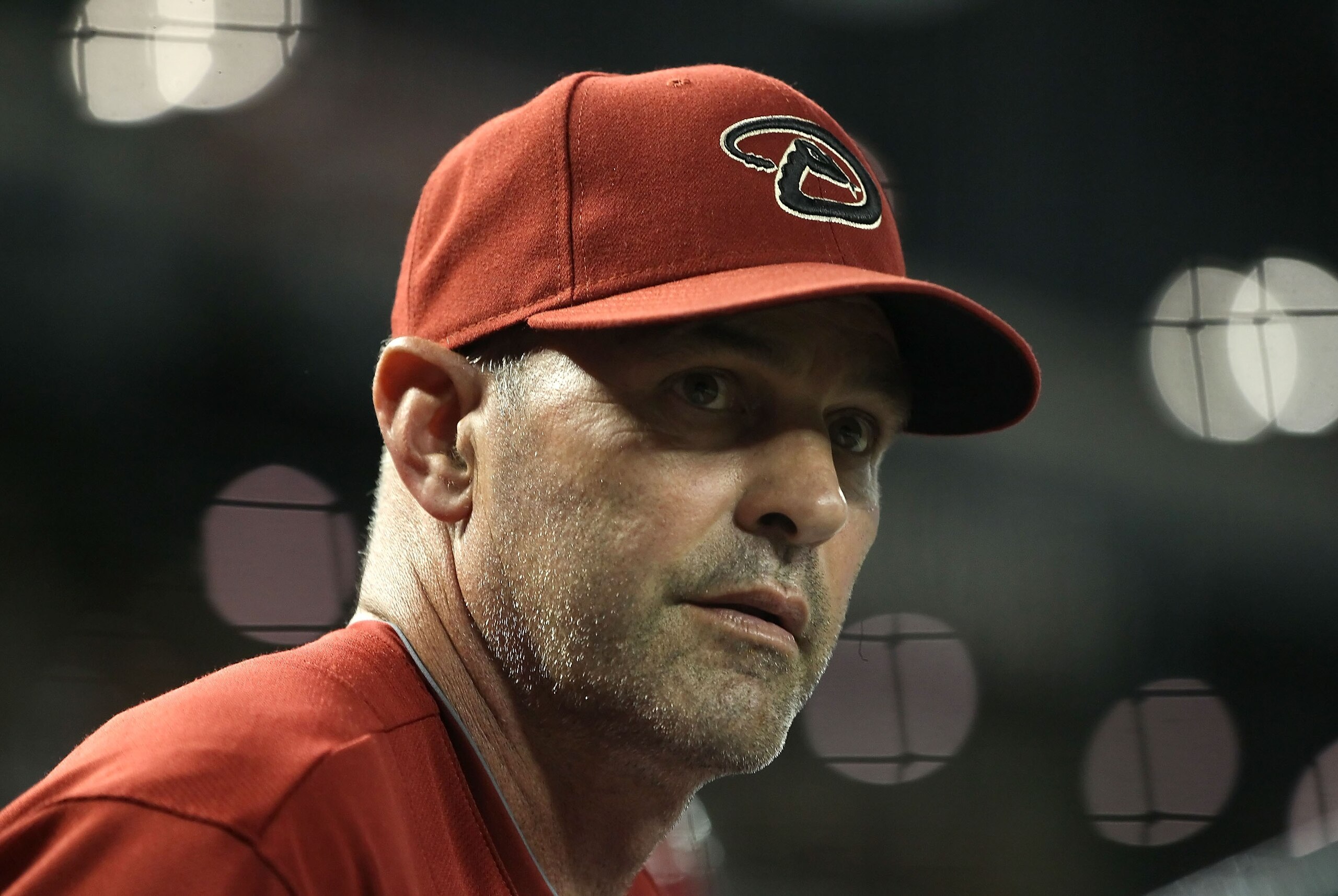 PHOENIX, AZ - MAY 18:  Manager Kirk Gibson of the Arizona Diamondbacks watches from the dugout during the Major League Baseball game against the Atlanta Braves at Chase Field on May 18, 2011 in Phoenix, Arizona. The Diamondbacks defeated the Braves 5-4 in