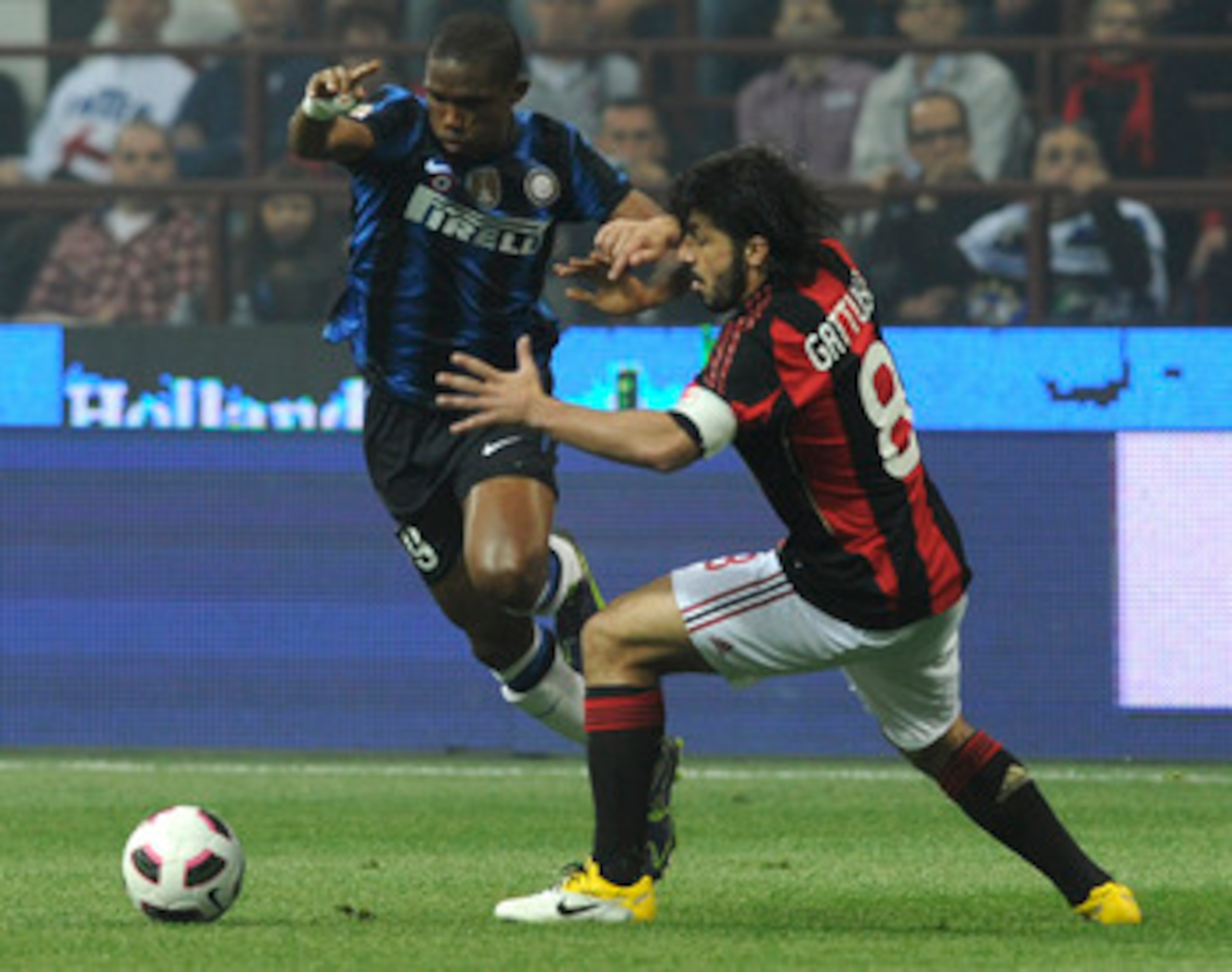 MILAN, ITALY - APRIL 02: (L - R) Samuel Eto'o of Inter competes with Gennaro Gattuso of Milan during the Serie A match between AC Milan and FC Internazionale Milano at Stadio Giuseppe Meazza on April 2, 2011 in Milan, Italy.  (Photo by Dino Panato/Getty I
