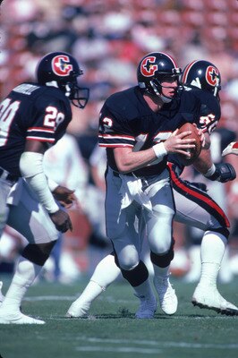 FEBRUARY 1985:  Quarterback Jim Kelly #12 of the Houston Gamblers scrambles during a 1985 season USFL game. (Photo by Stephen Dunn/Getty Images)
