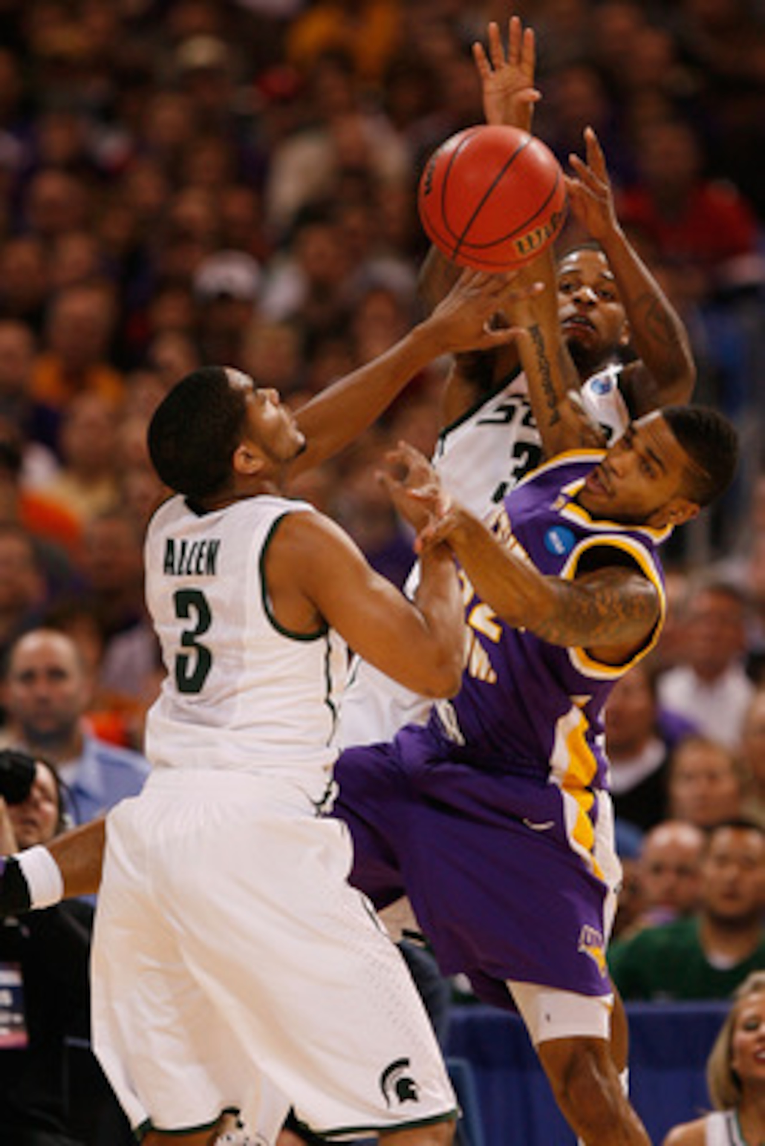 ST. LOUIS - MARCH 26: Chris Allen #3 and Korie Lucious #34 both of the Michigan State Spartans look to out rebound Anthony James #52 of the Northern Iowa Panthers during the midwest regional semifinal of the 2010 NCAA men's basketball tournament at the Ed