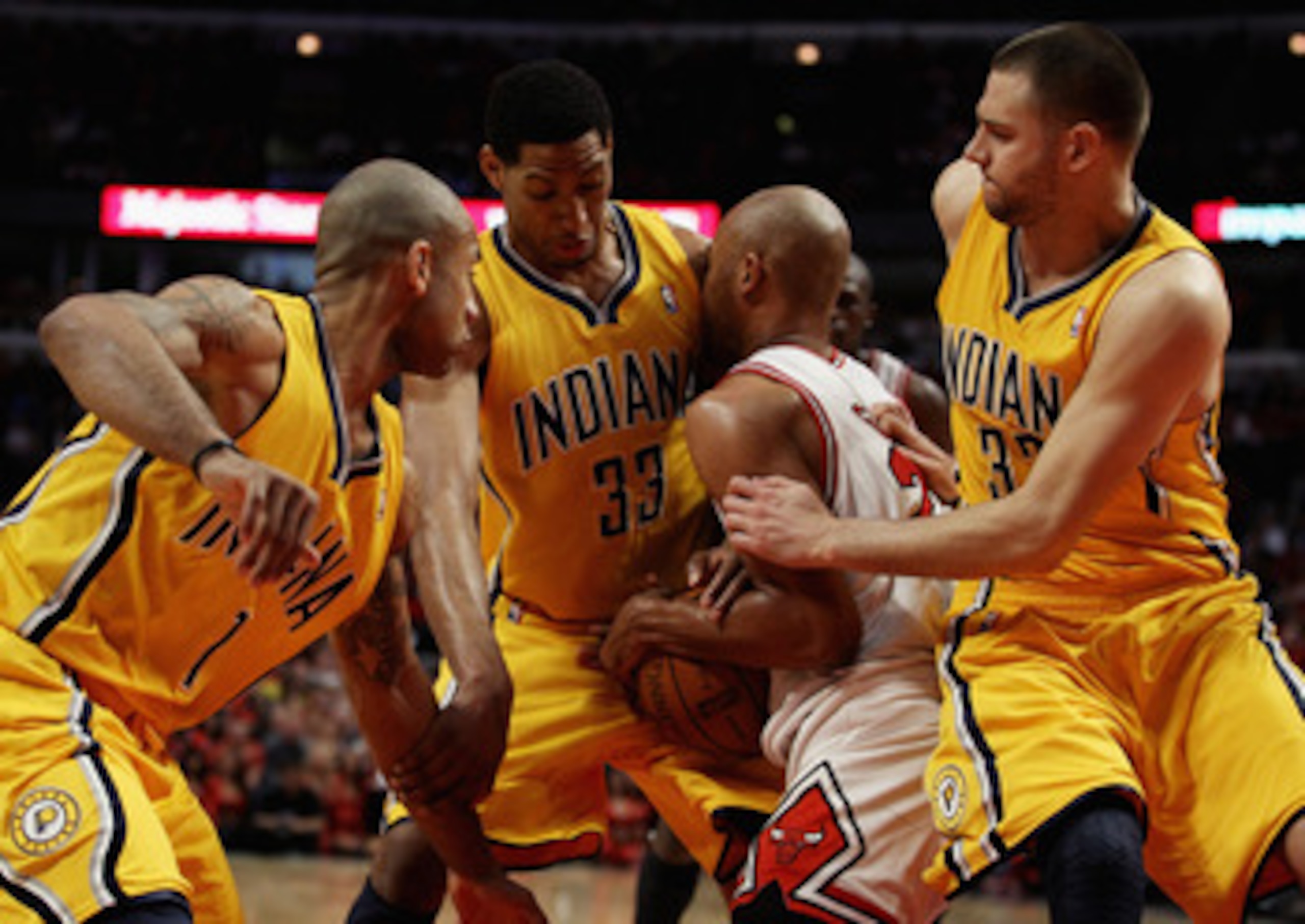CHICAGO, IL - APRIL 26: Taj Gibson #22 of the Chicago Bulls battles for the ball with (L-R) Dahntay Jones #1, Danny Granger #33 and Josh McRoberts #32 of the Indiana Pacers in Game Five of the Eastern Conference Quarterfinals in the 2011 NBA Playoffs at t
