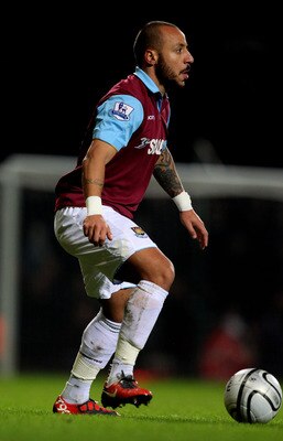 LONDON, ENGLAND - JANUARY 11:  Julien Faubert of West Ham controls the ball during the Carling Cup Semi Final first leg match between West Ham United and Birmingham City at the Boleyn Ground on January 11, 2011 in London, England.  (Photo by Clive Rose/Ge