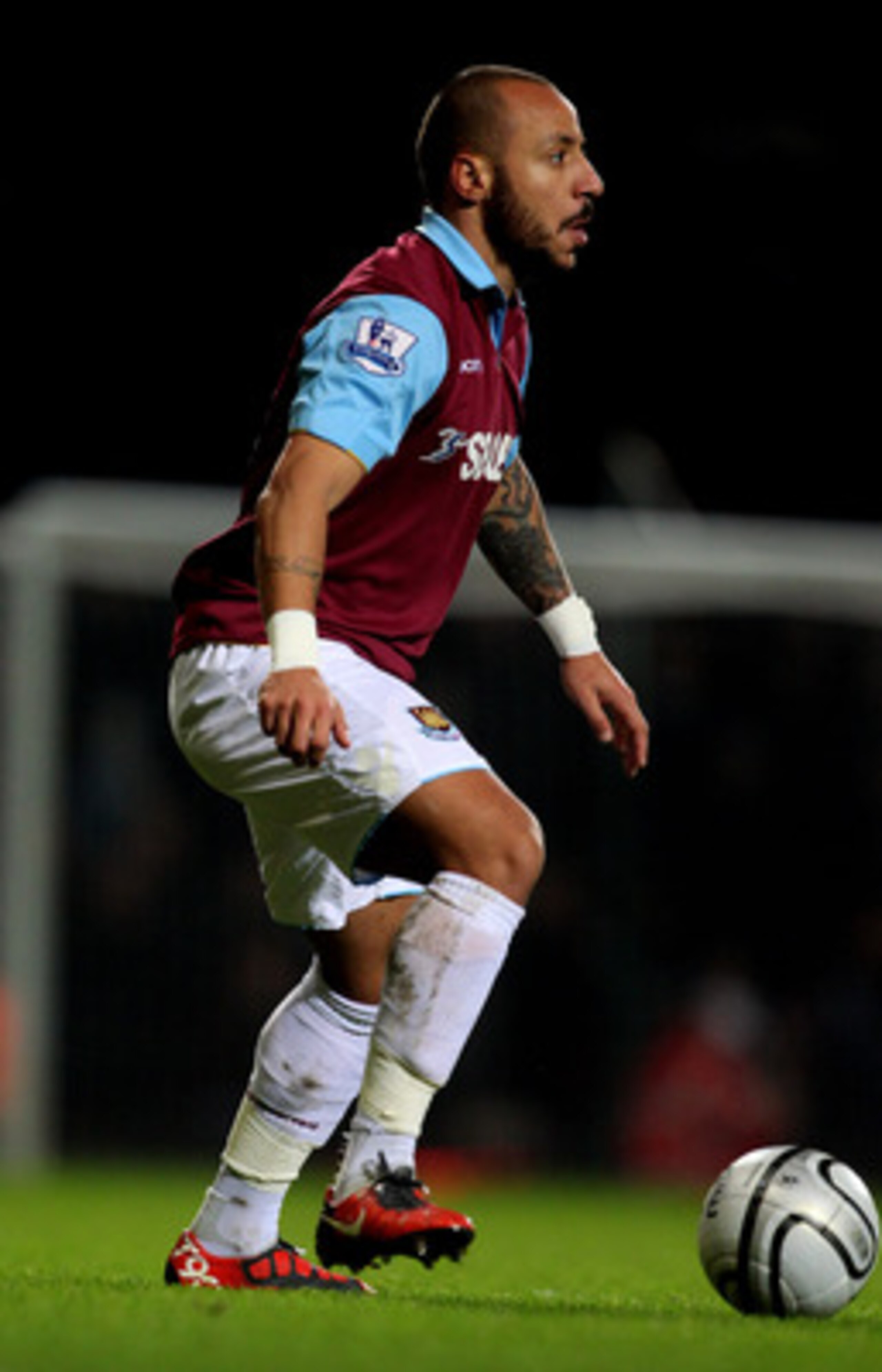 LONDON, ENGLAND - JANUARY 11:  Julien Faubert of West Ham controls the ball during the Carling Cup Semi Final first leg match between West Ham United and Birmingham City at the Boleyn Ground on January 11, 2011 in London, England.  (Photo by Clive Rose/Ge