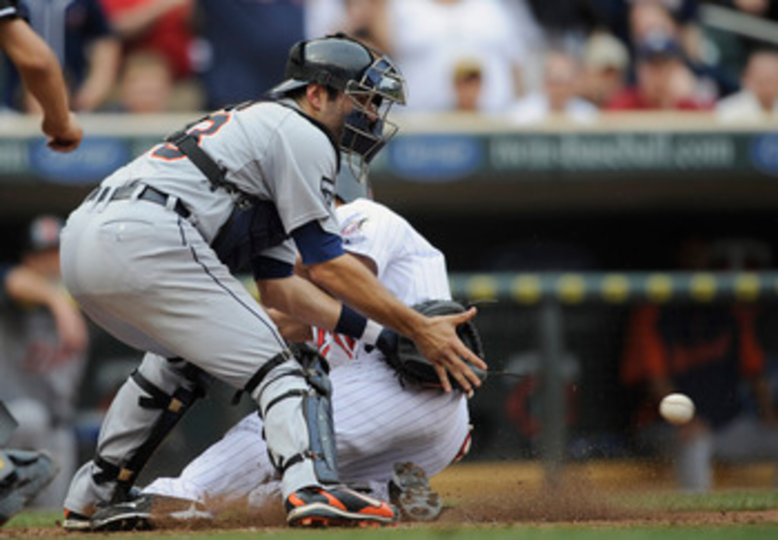 MINNEAPOLIS, MN - MAY 11: Ben Revere #11 of the Minnesota Twins slides safely into home plate as Alex Avila #13 of the Detroit Tigers defends during in the eighth inning of their game on May 11, 2011 at Target Field in Minneapolis, Minnesota. Tigers defea