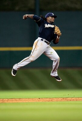HOUSTON - APRIL 30: Second baseman Rickie Weeks #23 of the Milwaukee Brewers makes a leaping throw to first base against the Houston Astros at Minute Maid Park on April 30, 2011 in Houston, Texas.  (Photo by Bob Levey/Getty Images)